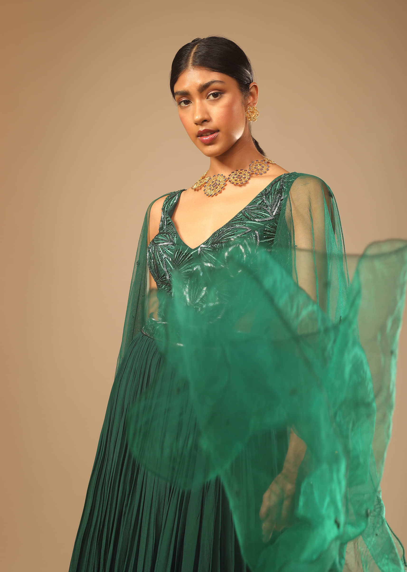 Bottle Green Gown In Crepe With Side Cut Outs In The Hand Embroidered Bodice  
