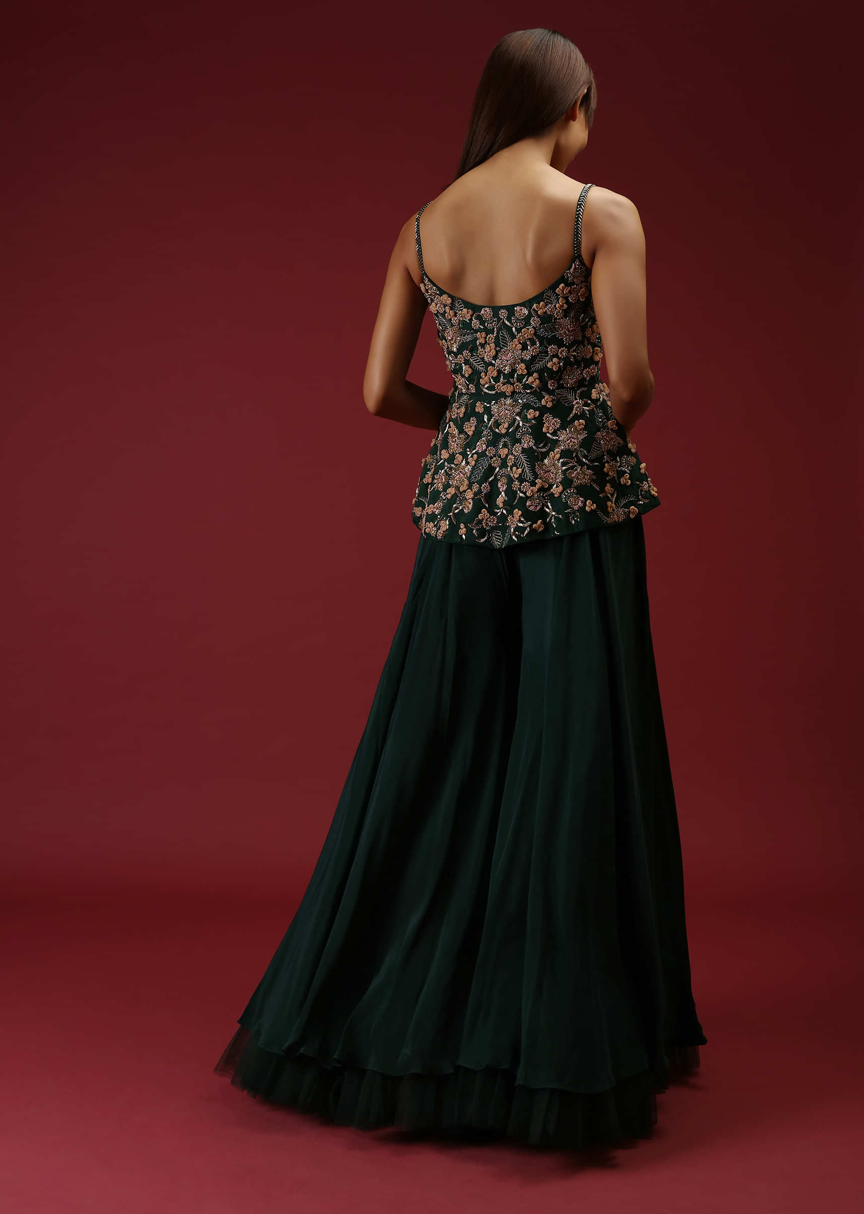 Bottle Green Palazzo Pants With A Heavy Hand Embroidered Peplum Top Adorned In Multicolored Beads And 3D Flowers  