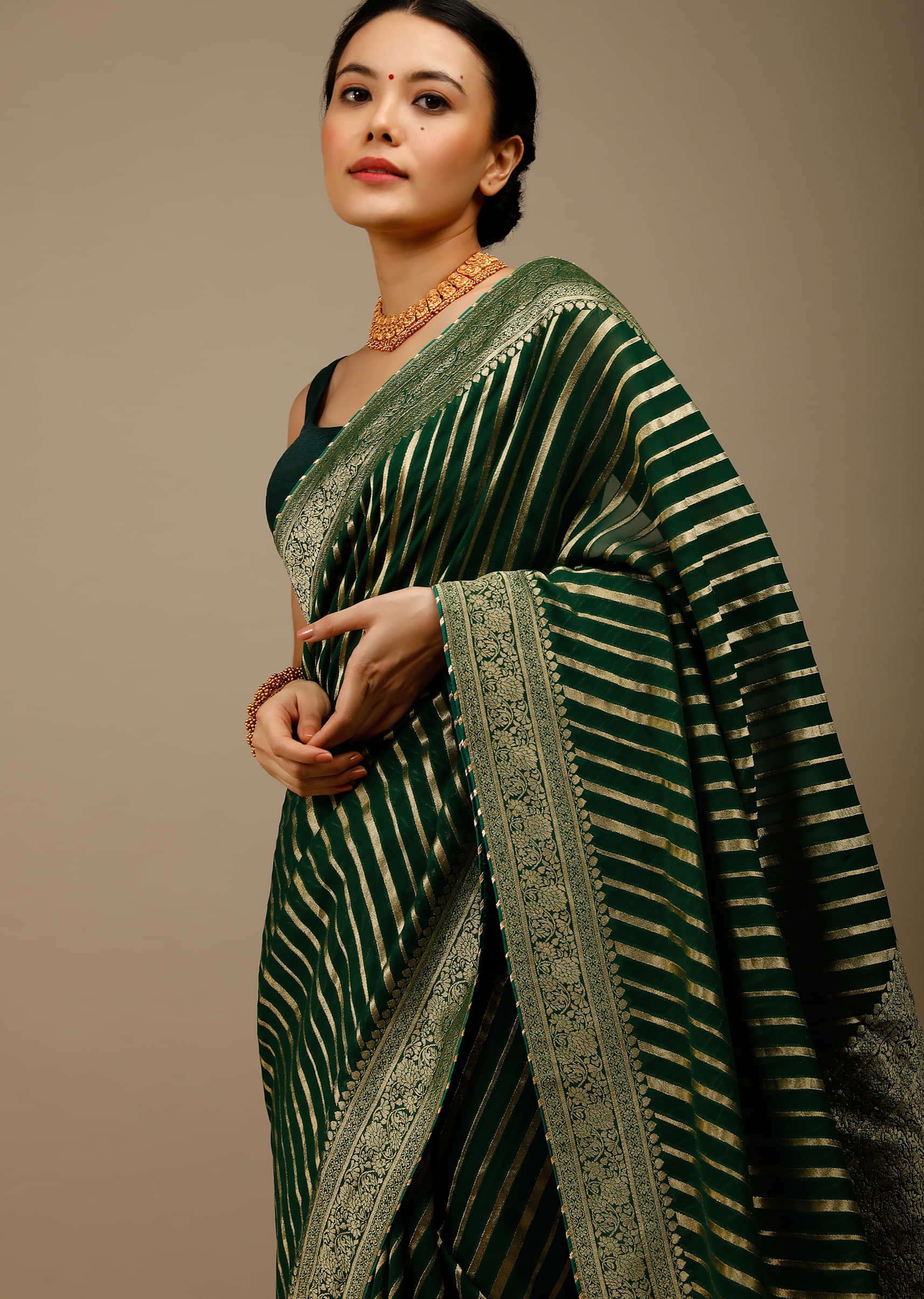Bottle Green Saree In Georgette With Brocade Woven Diagonal Stripes And Floral Border  