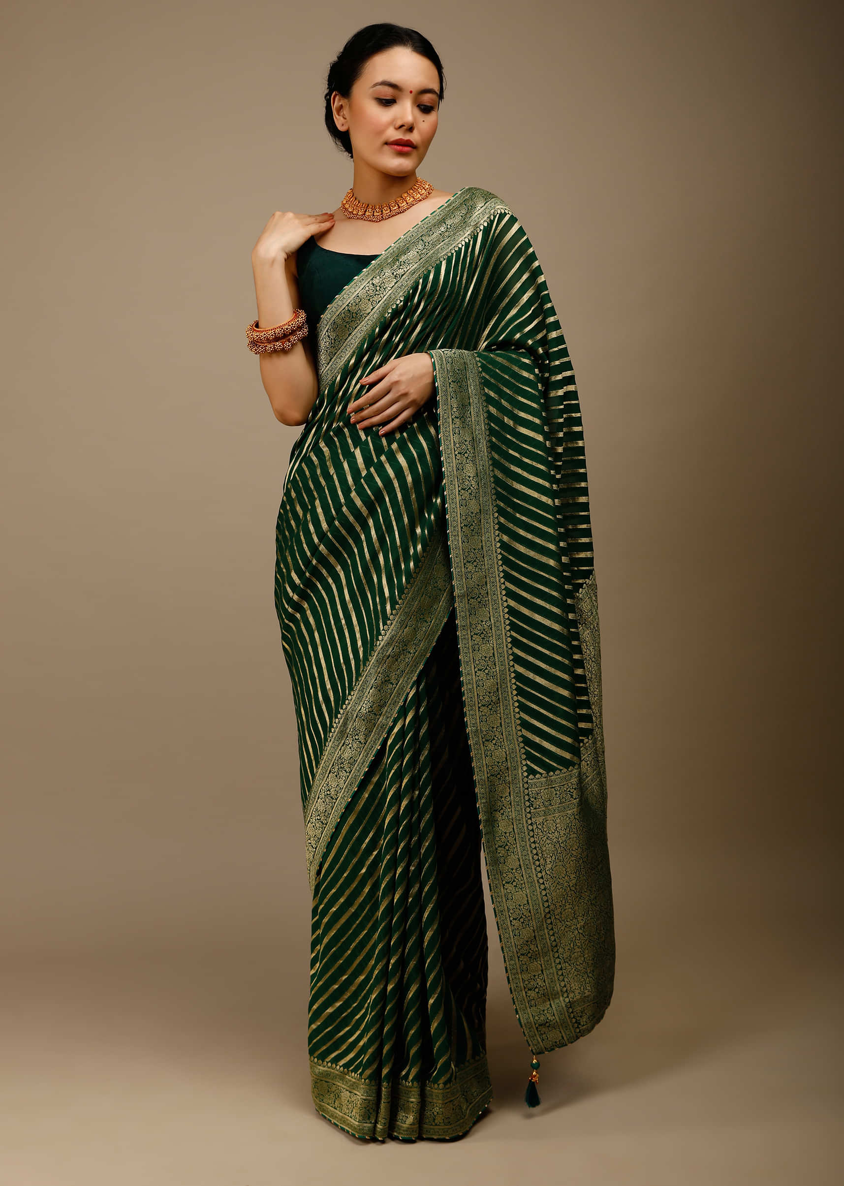 Bottle Green Saree In Georgette With Brocade Woven Diagonal Stripes And Floral Border  