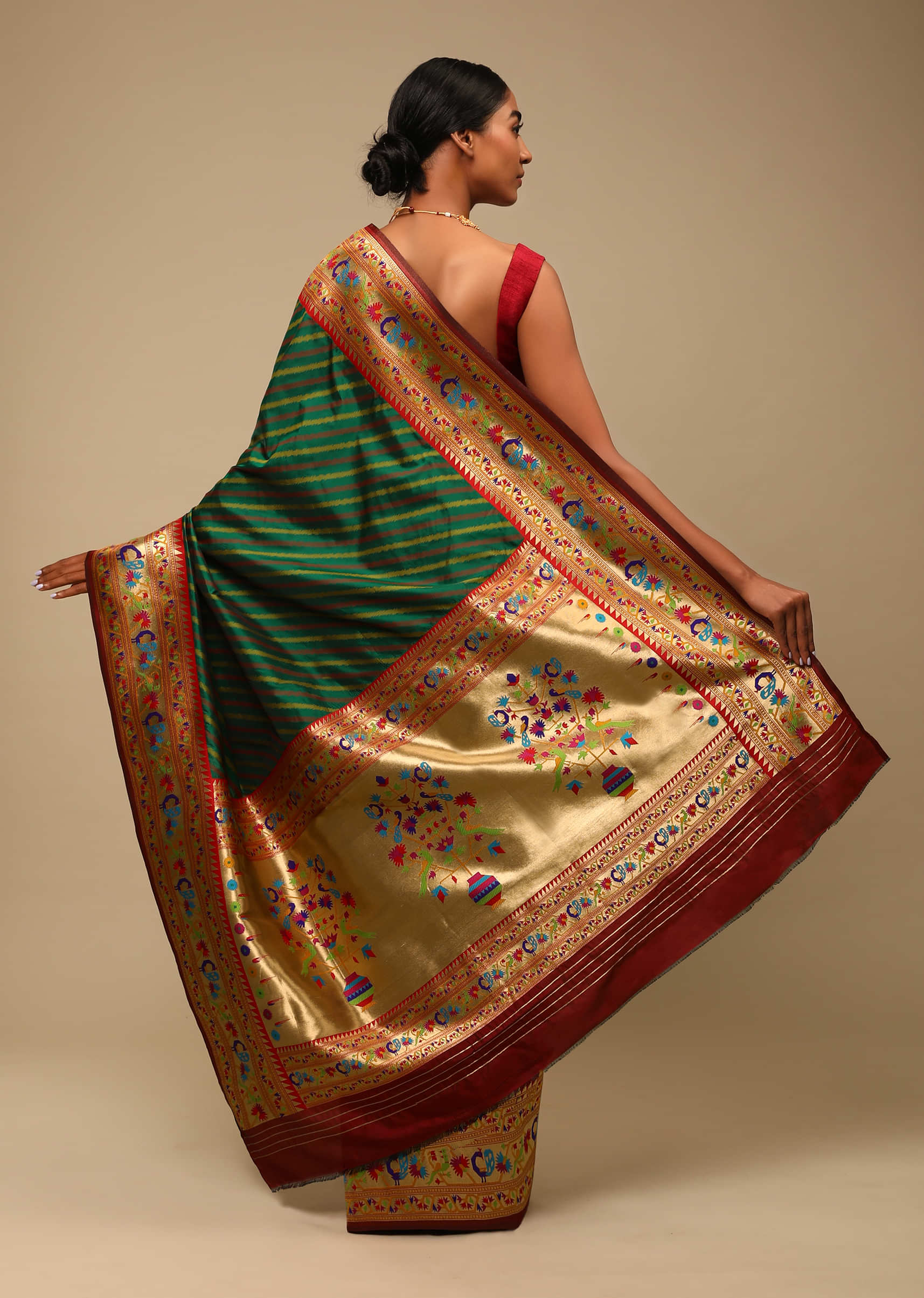 Bottle Green Saree In Art Handloom Silk With Woven Multi Colored Peacock Motifs On The Border, Diagonal Stripes And Unstitched Blouse  