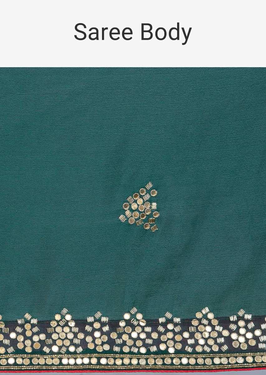 Bottle green satin chiffon saree with cut dana and mirror embroidered butti and border only on Kalki