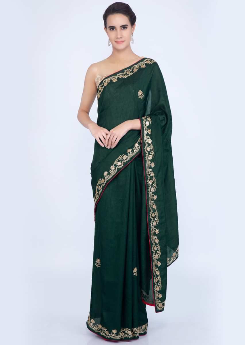 Bottle green silk saree with embroidered butti and border only on Kalki