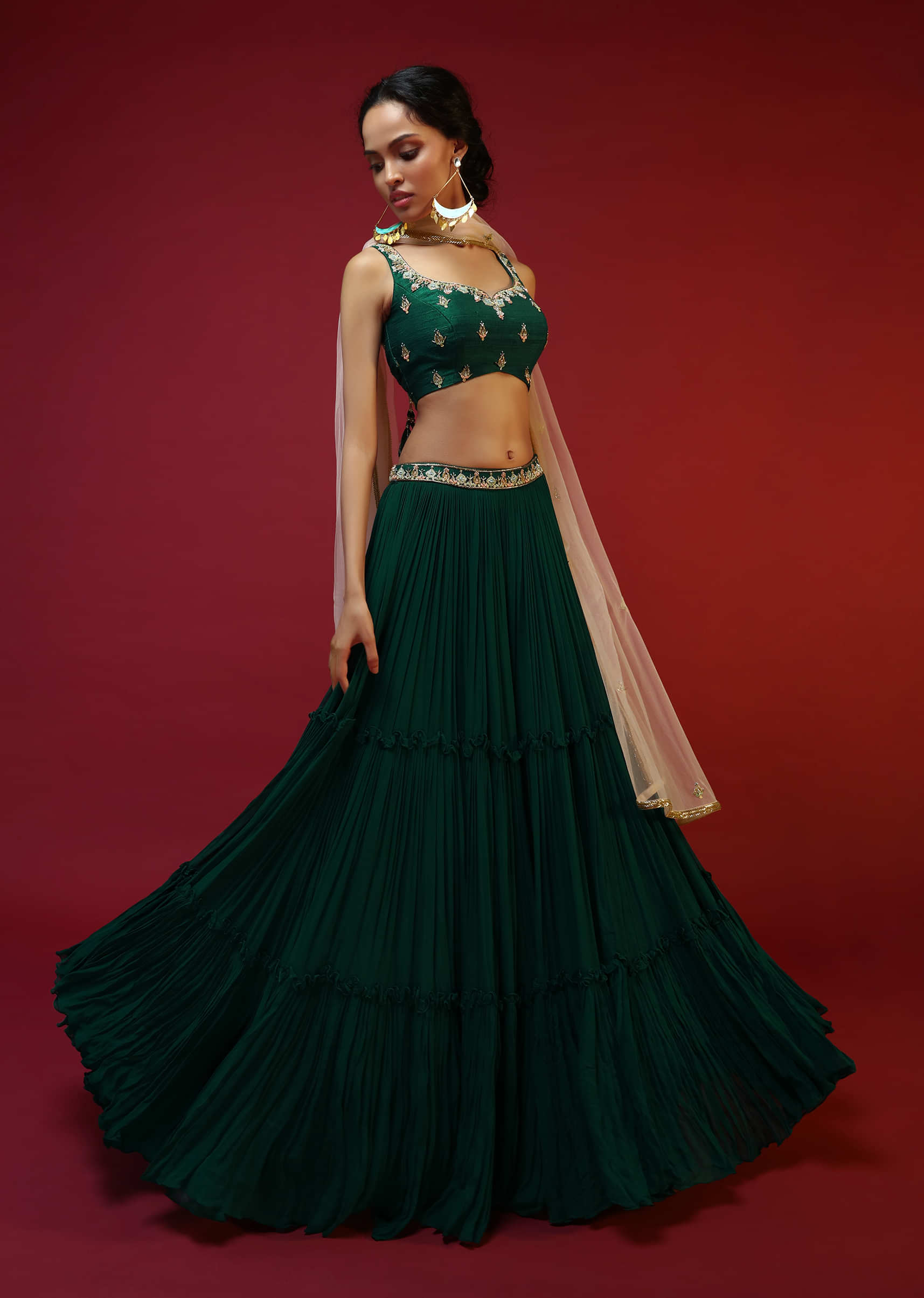 Bottle Green Tiered Lehenga Choli With Hand Embroidered Buttis Using Colorful Beads And Sequins 