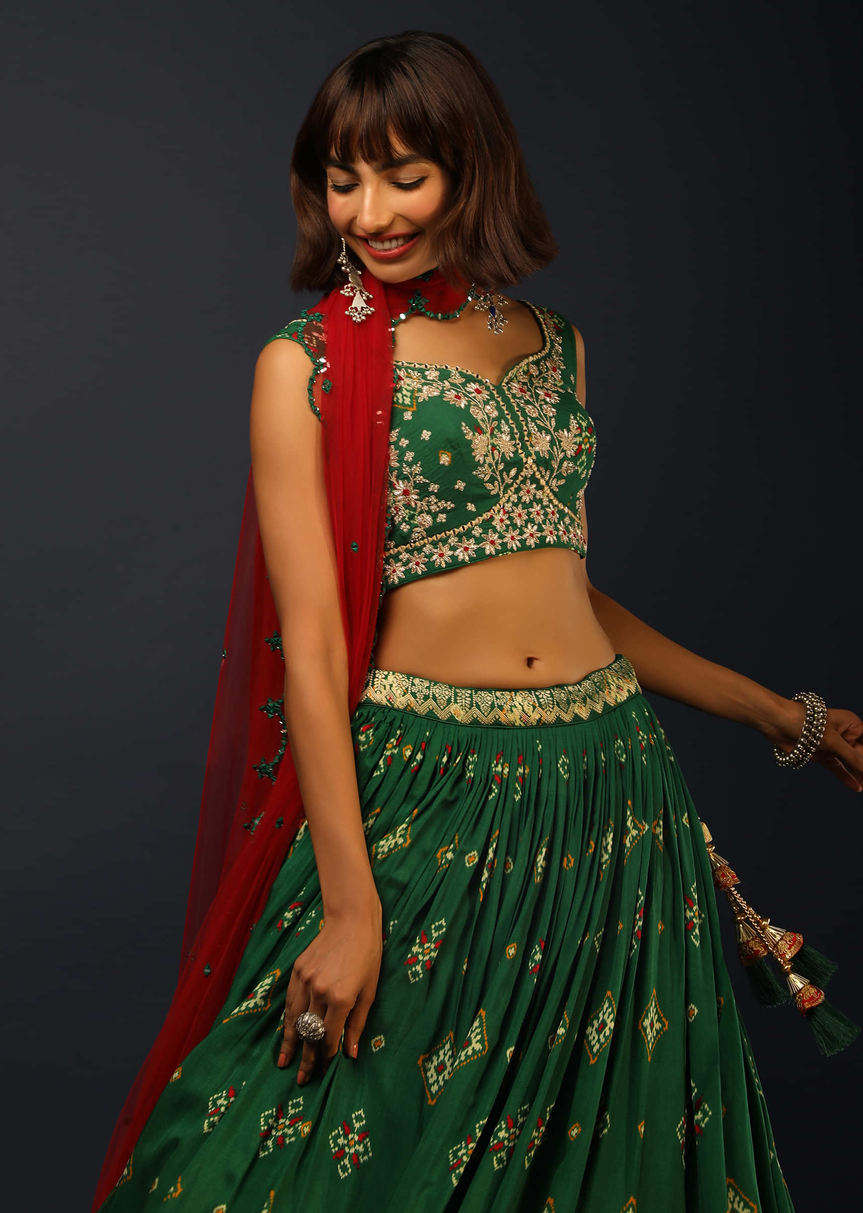 Bottle Green Lehenga In Silk With Patola Printed Buttis And Woven Maroon Border 