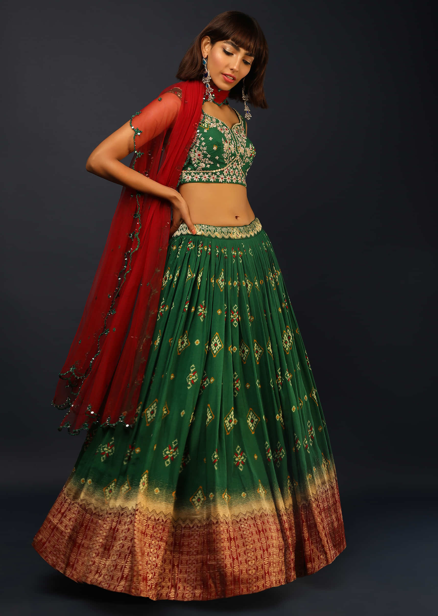 Bottle Green Lehenga In Silk With Patola Printed Buttis And Woven Maroon Border 