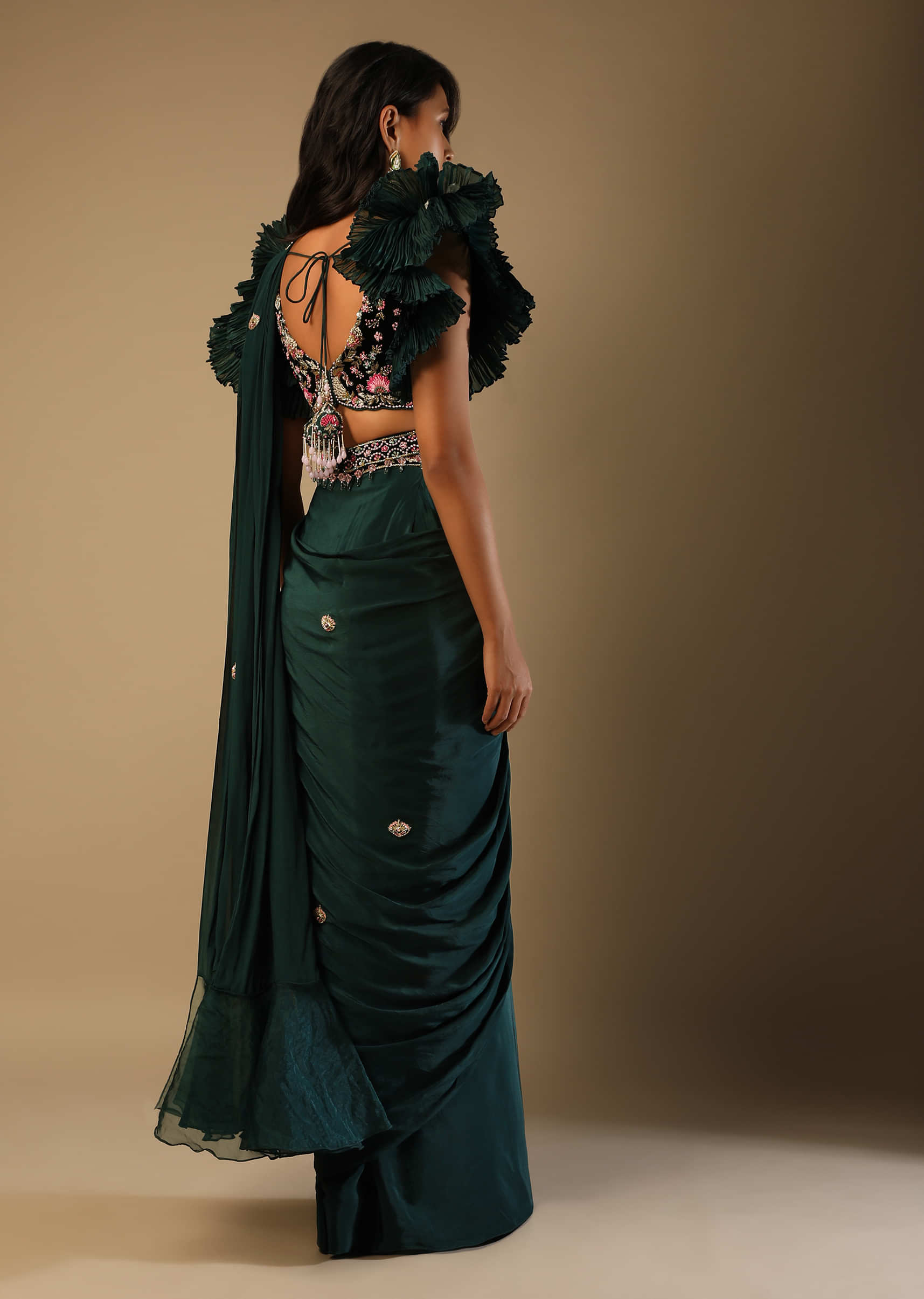Bottle Green Ready Pleated Saree With A Colorful Hand Embroidered Blouse With Fancy Layered Frill Sleeves  