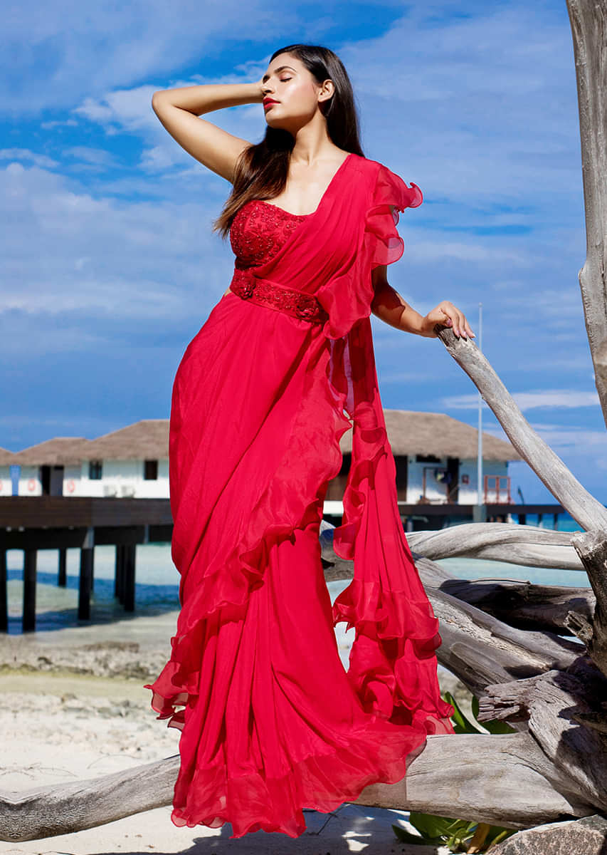 Bright Red Ready Pleated Saree With Ruffled Pallo Paired With A Strapless Hand Embroidered Blouse