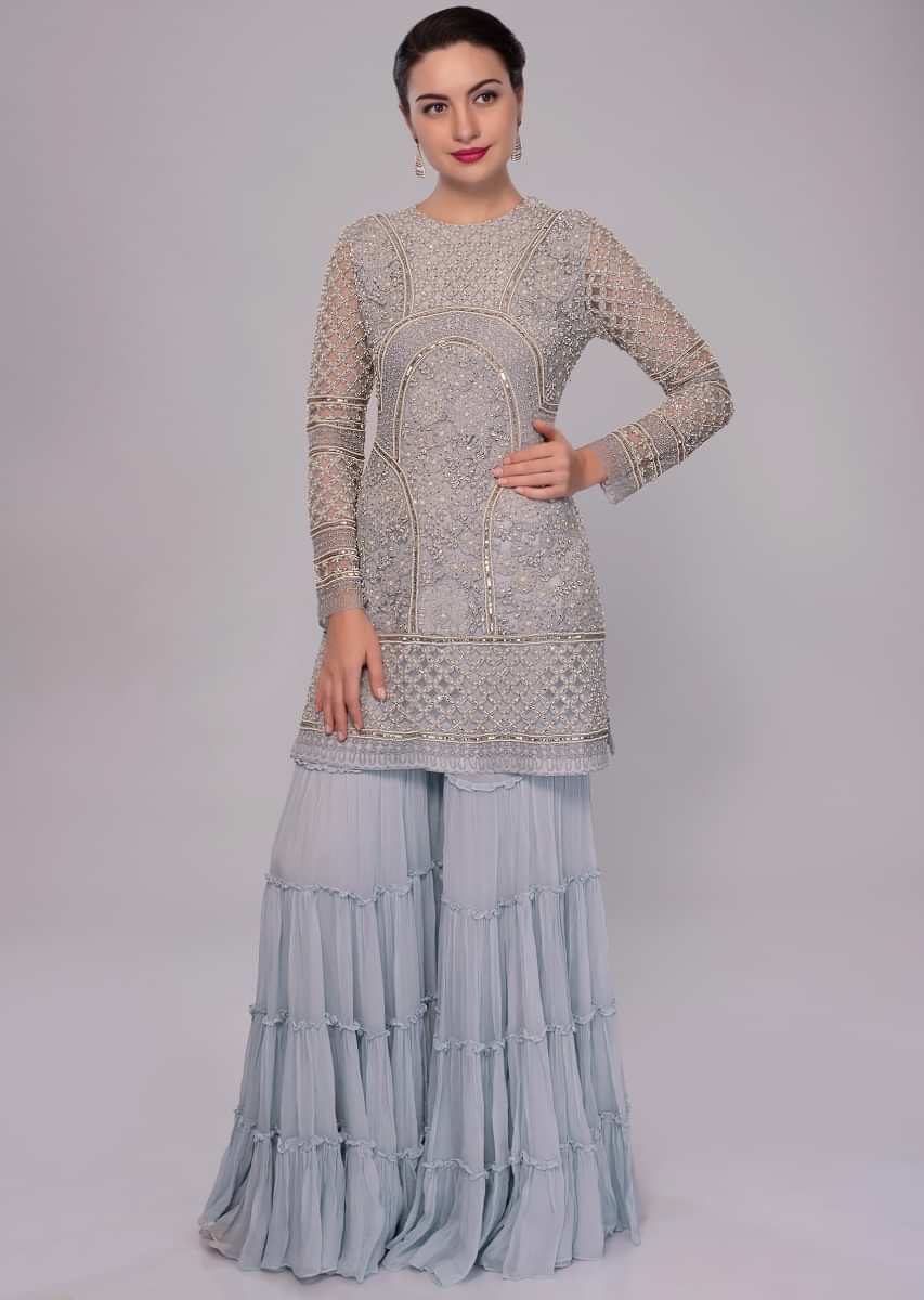 Brittany blue net embroidered suit with matching georgette sharara