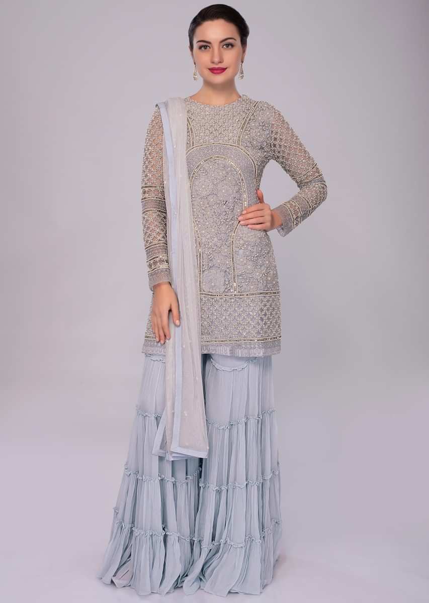 Brittany blue net embroidered suit with matching georgette sharara