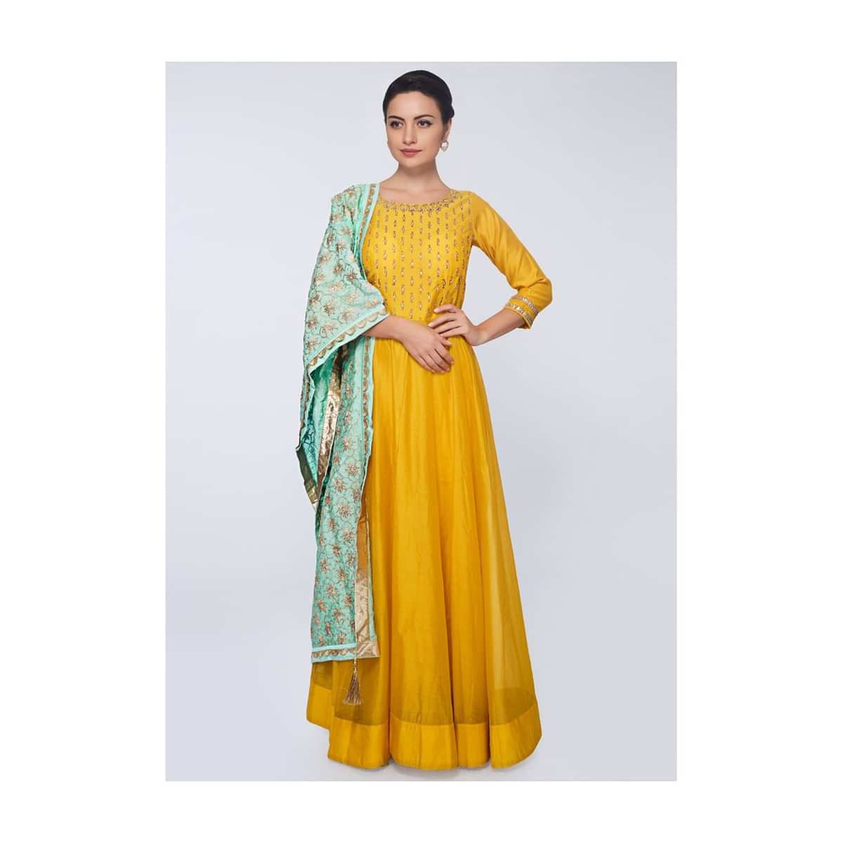 Canary yellow silk anarkali gown paired with mint green  cotton dupatta in lace embroidery only on Kalki