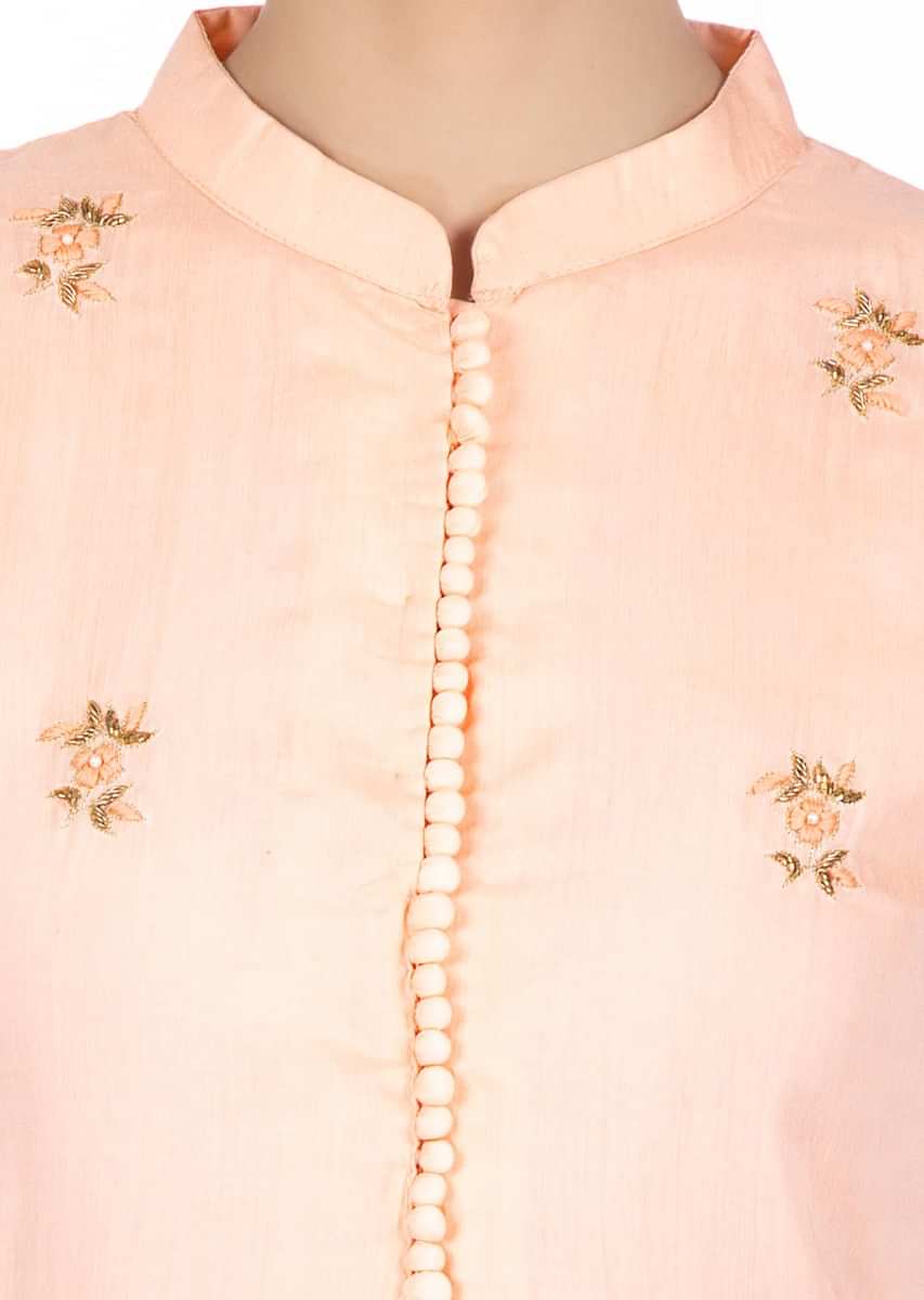 Cantaloupe peach cotton suit in floral embroidered butti with matching sharara pants 