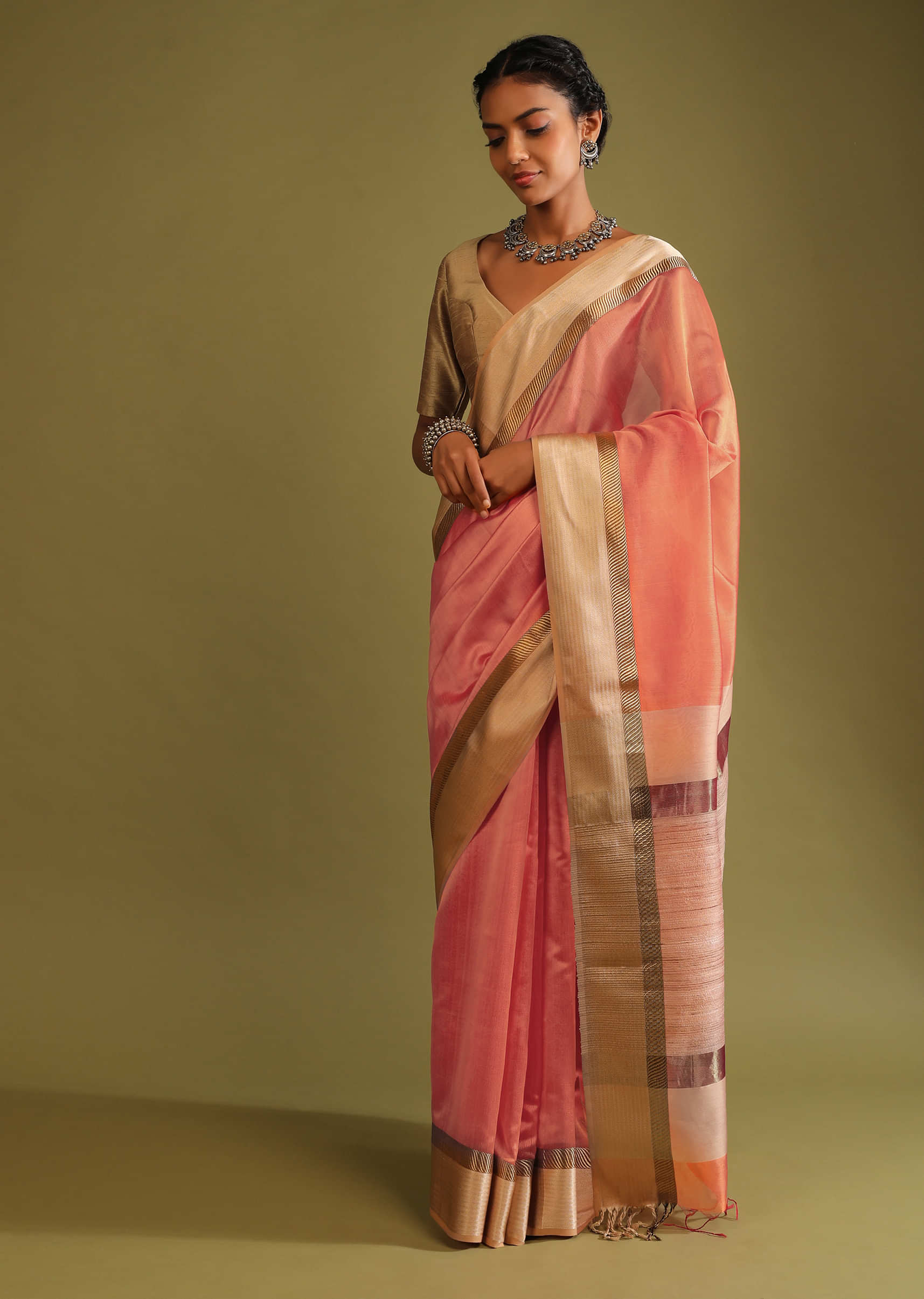 Carrot Coral Saree In Tussar Silk With A Contrasting Woven Golden Border And Textured Tussar Detailing On The Pallu  