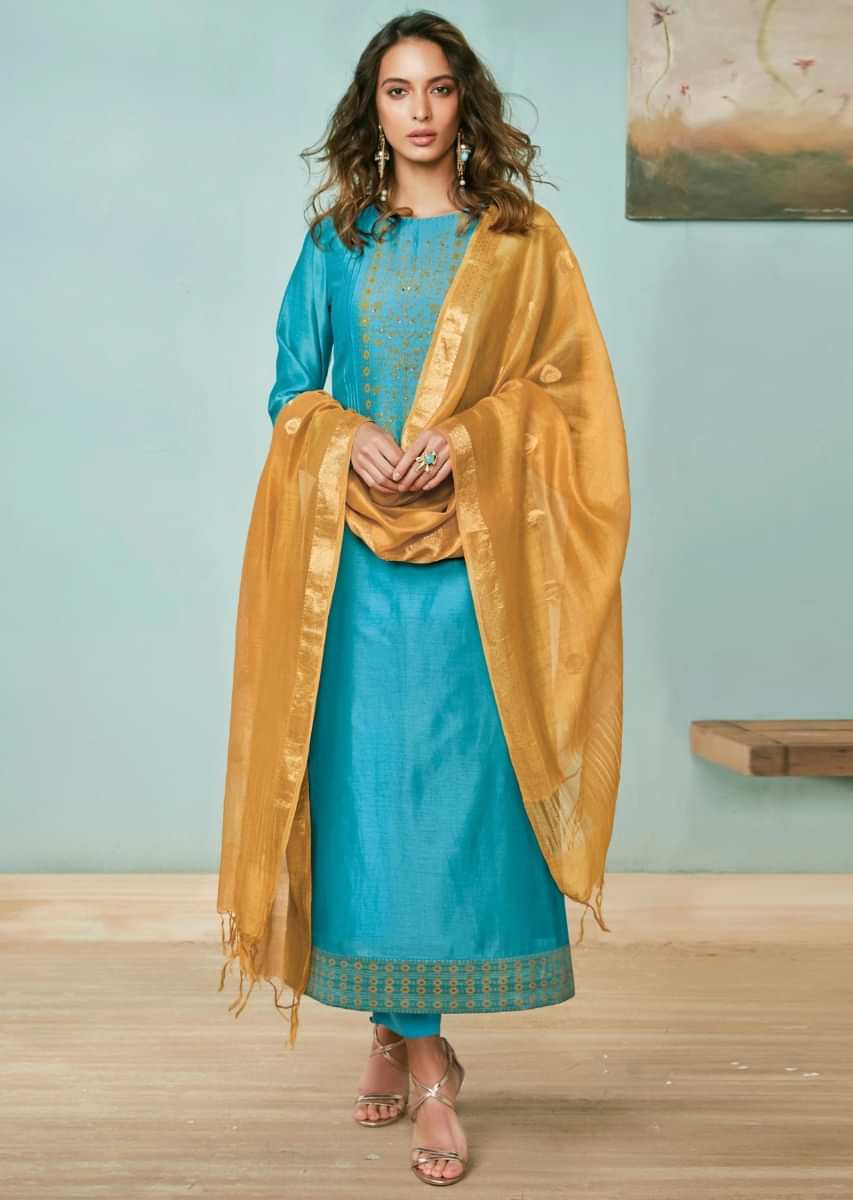 Cerulean blue unstitched suit adorn in foil printed placket in floral motif matched with mustard dupatta