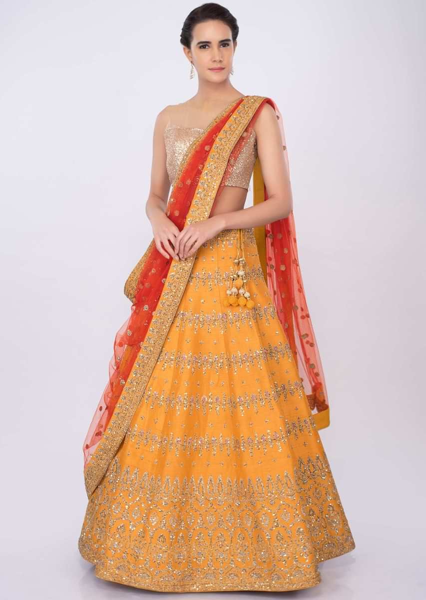 Chrome Yellow Lehenga In Raw Silk With Orange Net Dupatta Online - Kalki Fashion