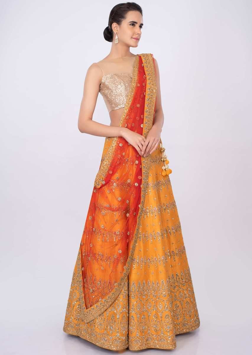 Chrome Yellow Lehenga In Raw Silk With Orange Net Dupatta Online - Kalki Fashion