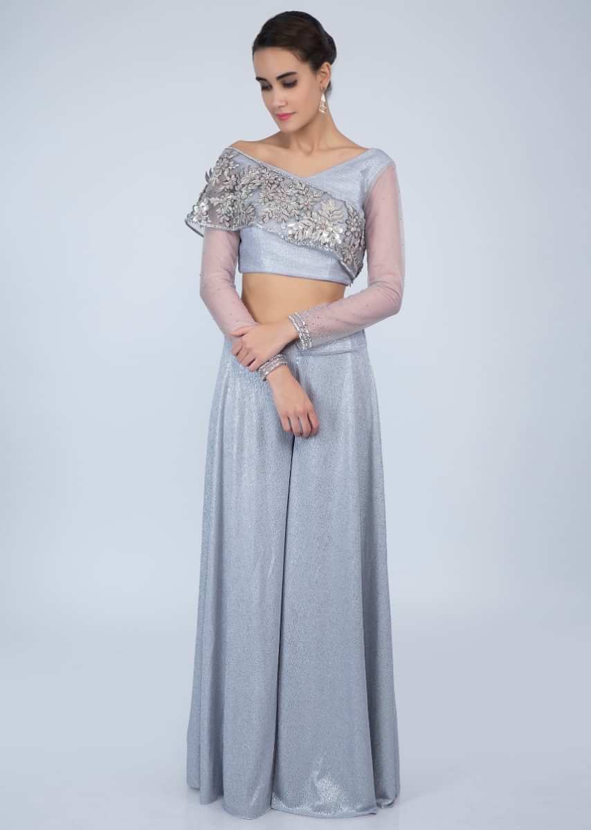 Cream patola printed flared palazzo with a double layer frilled crop top  only on Kalki