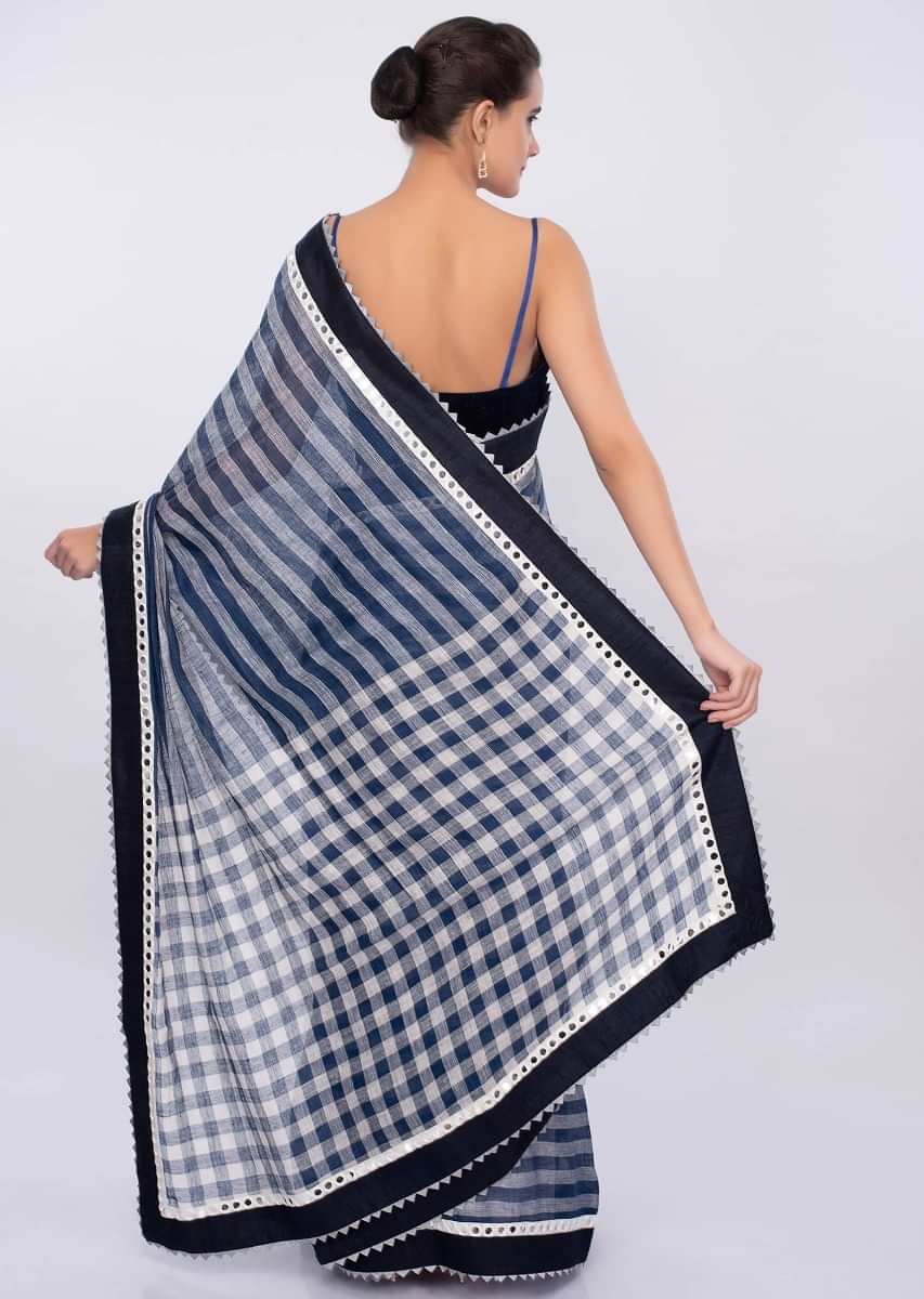 Cobalt blue and white striped linen saree with mirror embroidered border only on Kalki
