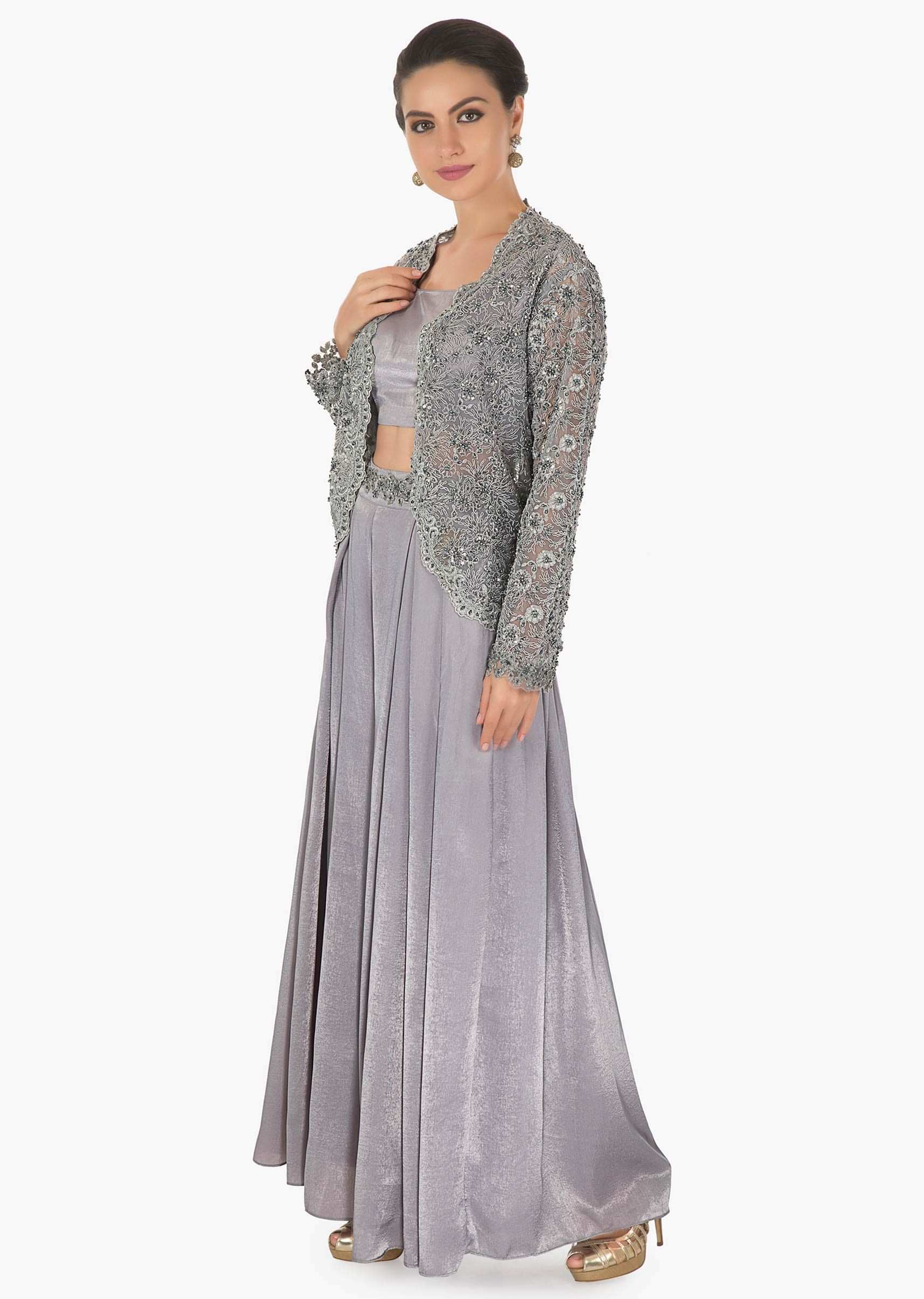 Coin grey velvet base palazzo pant matched with a simple crop top along with a net cord moti jacket only on kalki