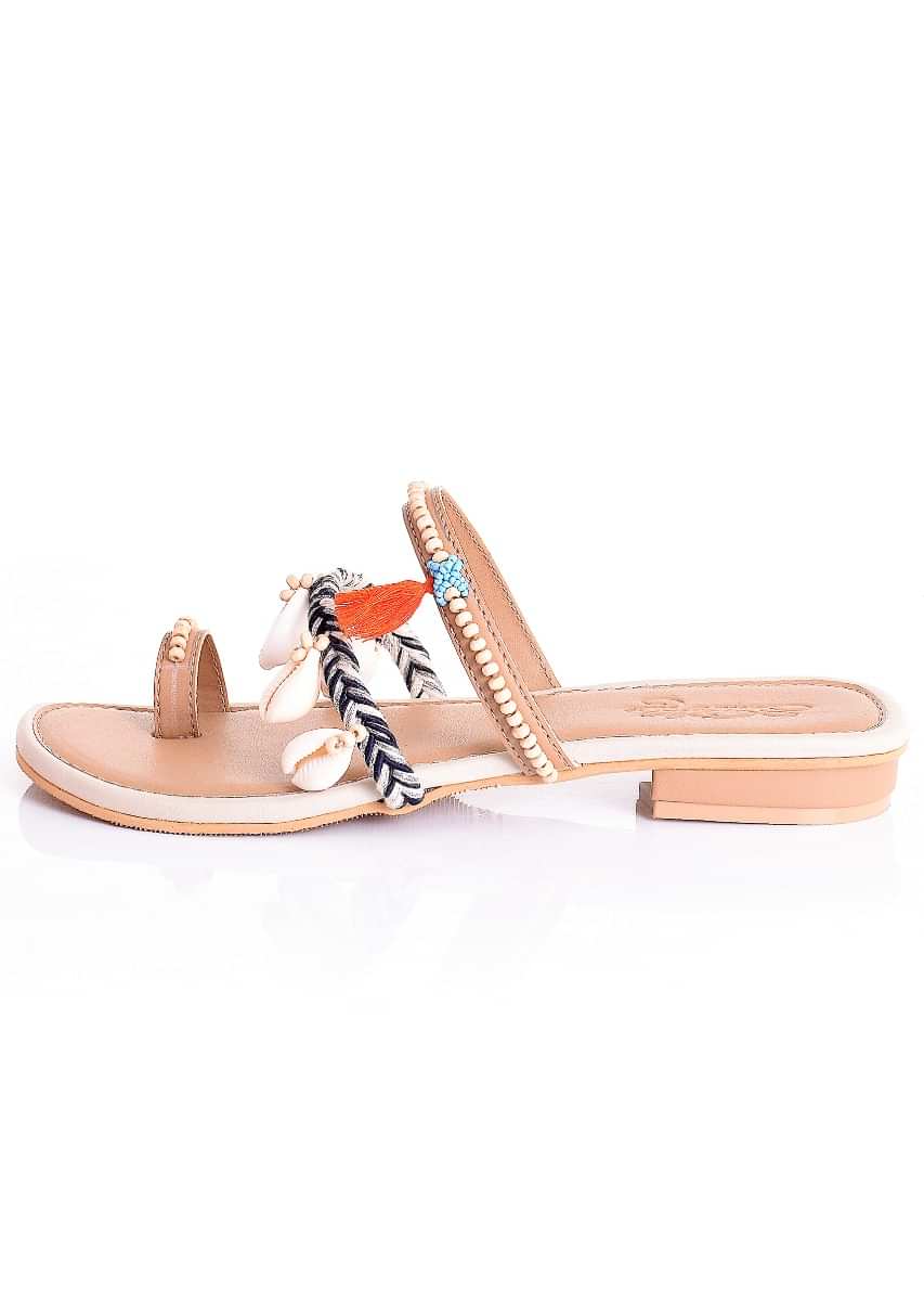 Cream Multistrap Slider Flats With Conchas, Turquoise Beads And Orange Tassels By Sole House