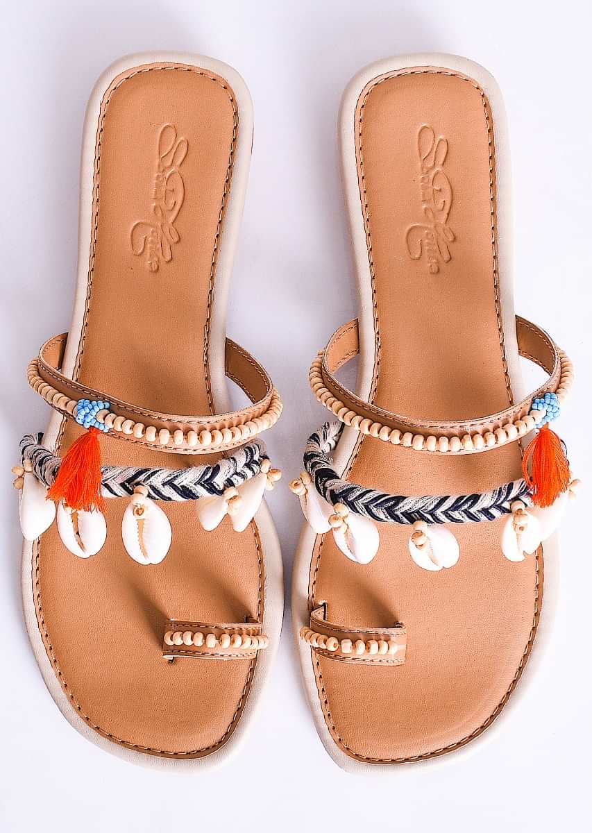Cream Multistrap Slider Flats With Conchas, Turquoise Beads And Orange Tassels By Sole House