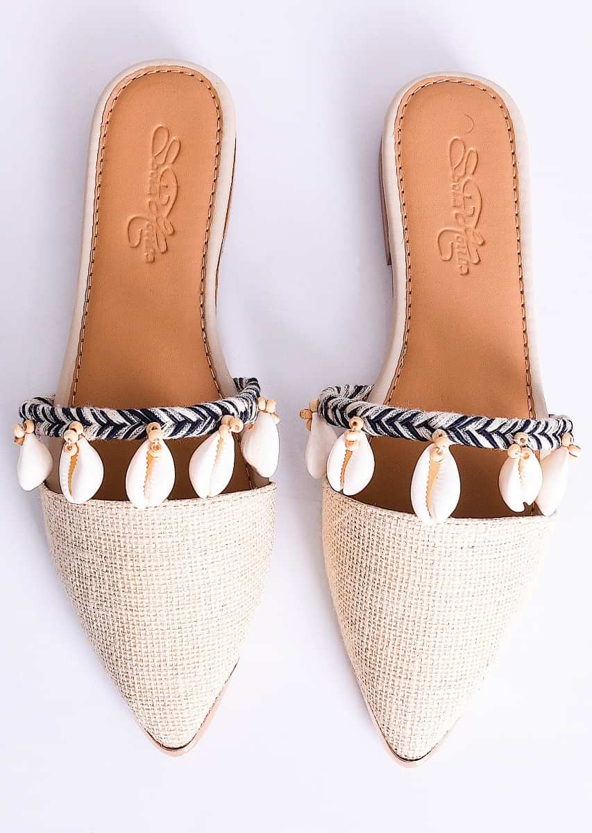 Cream Beige Mules Adorned In Wooden Beads And Conchas Along With Black Braiding By Sole House