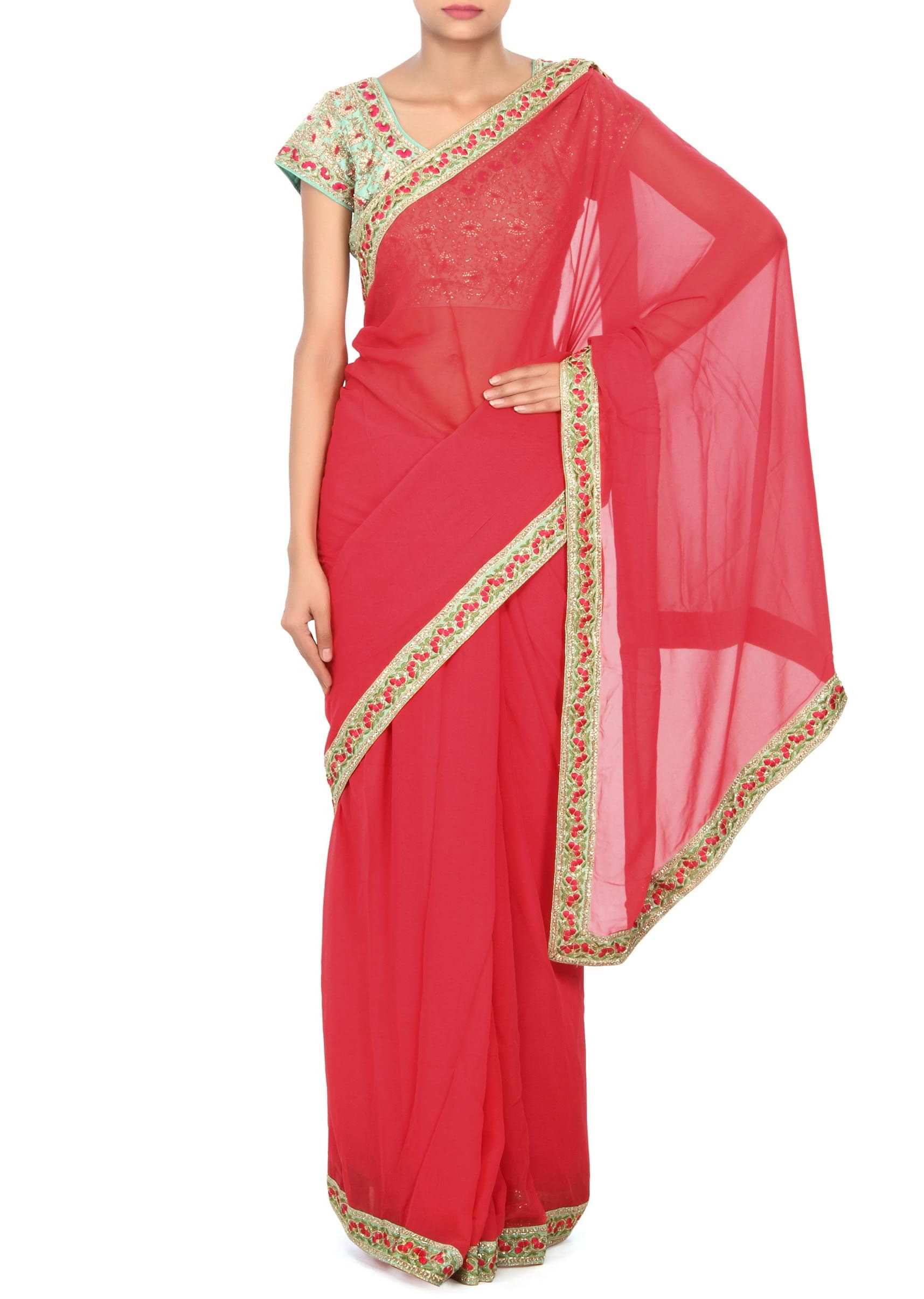 Coral pink saree matched with embroidered blouse only on Kalki
