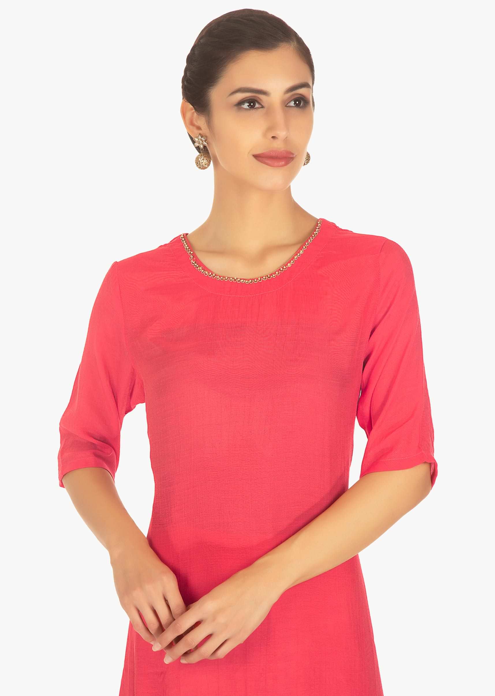 Coral pink silk top paired with a brown cotton dhoti pants