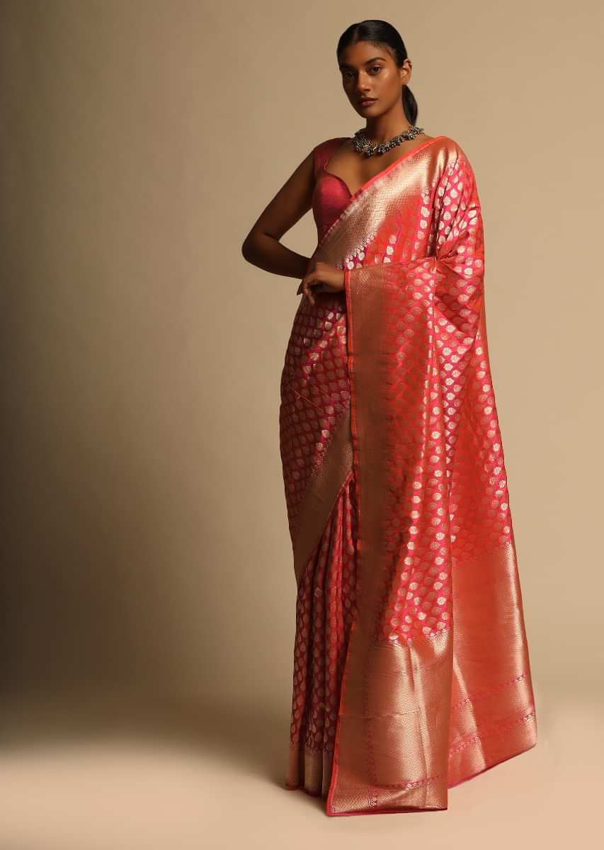 Coral Pink Two Toned Banarasi Saree In Pure Handloom Silk With Woven Floral Buttis And Chevron Border Along With Unstitched Blouse Piece  