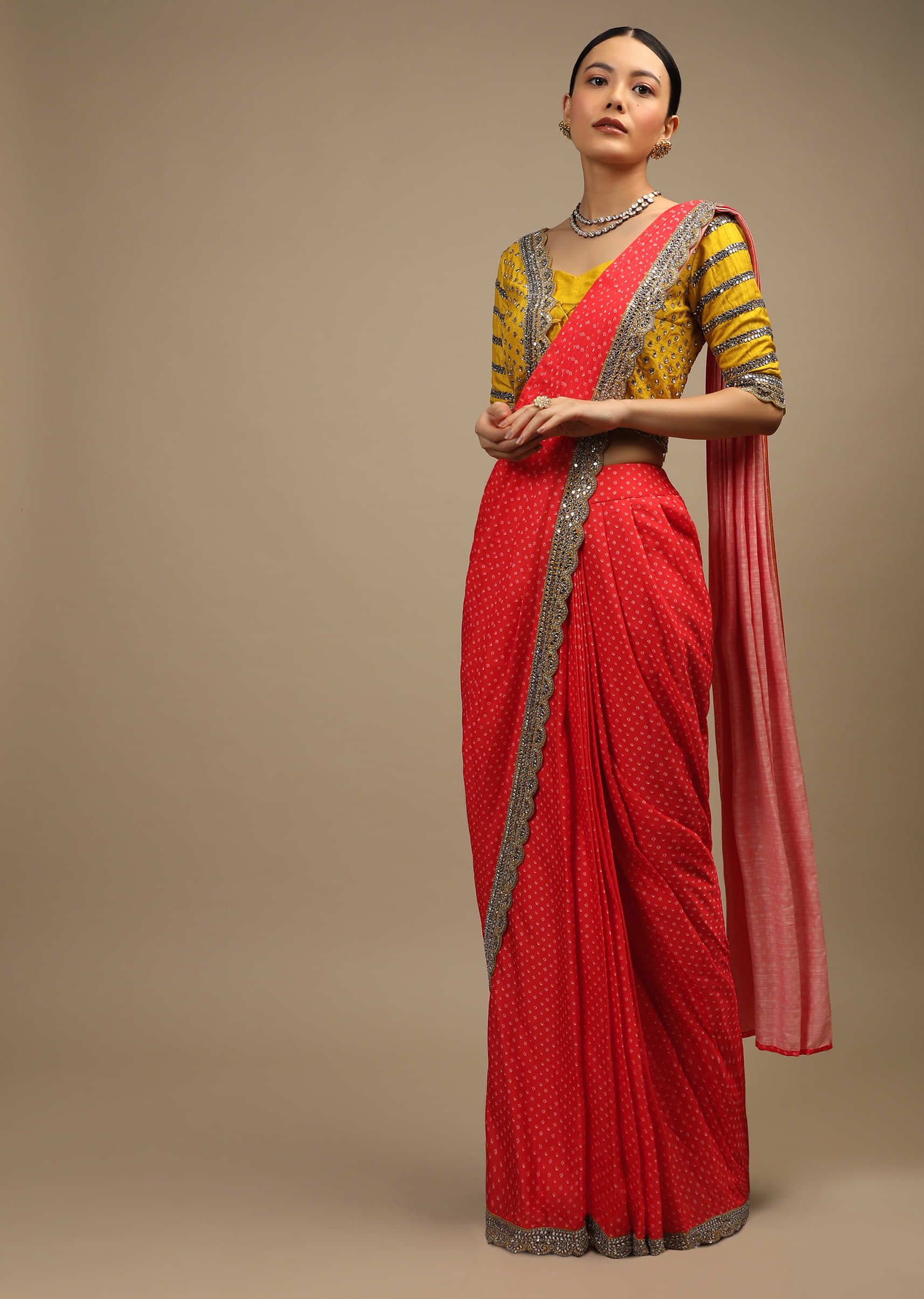 Coral Ready Pleated Saree In Satin With Bandhani Print And Mustard Choli Enhanced With Mirror Work  