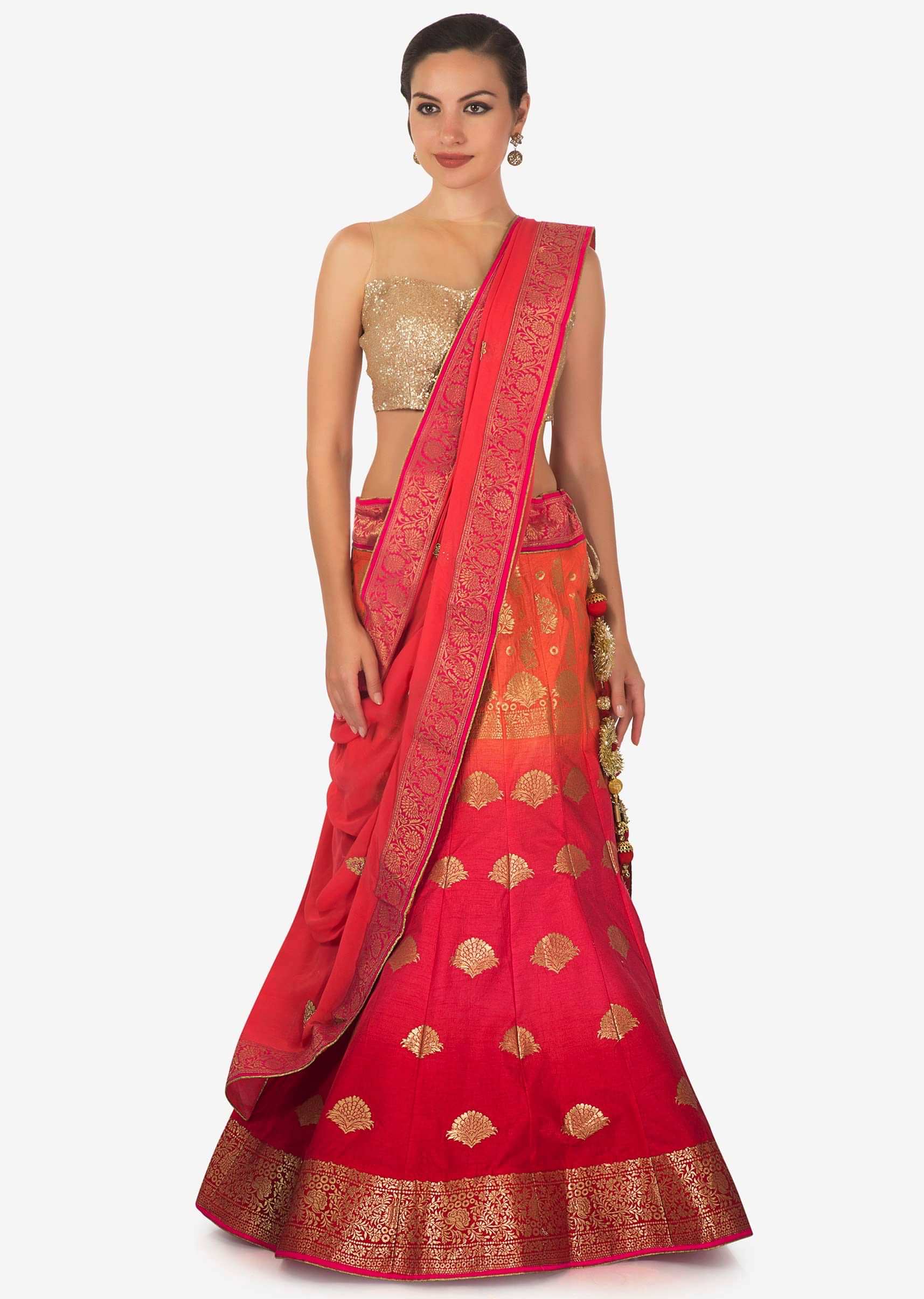 Coral and orange shaded lehenga in silk enhanced in weave embroidery only on Kalki