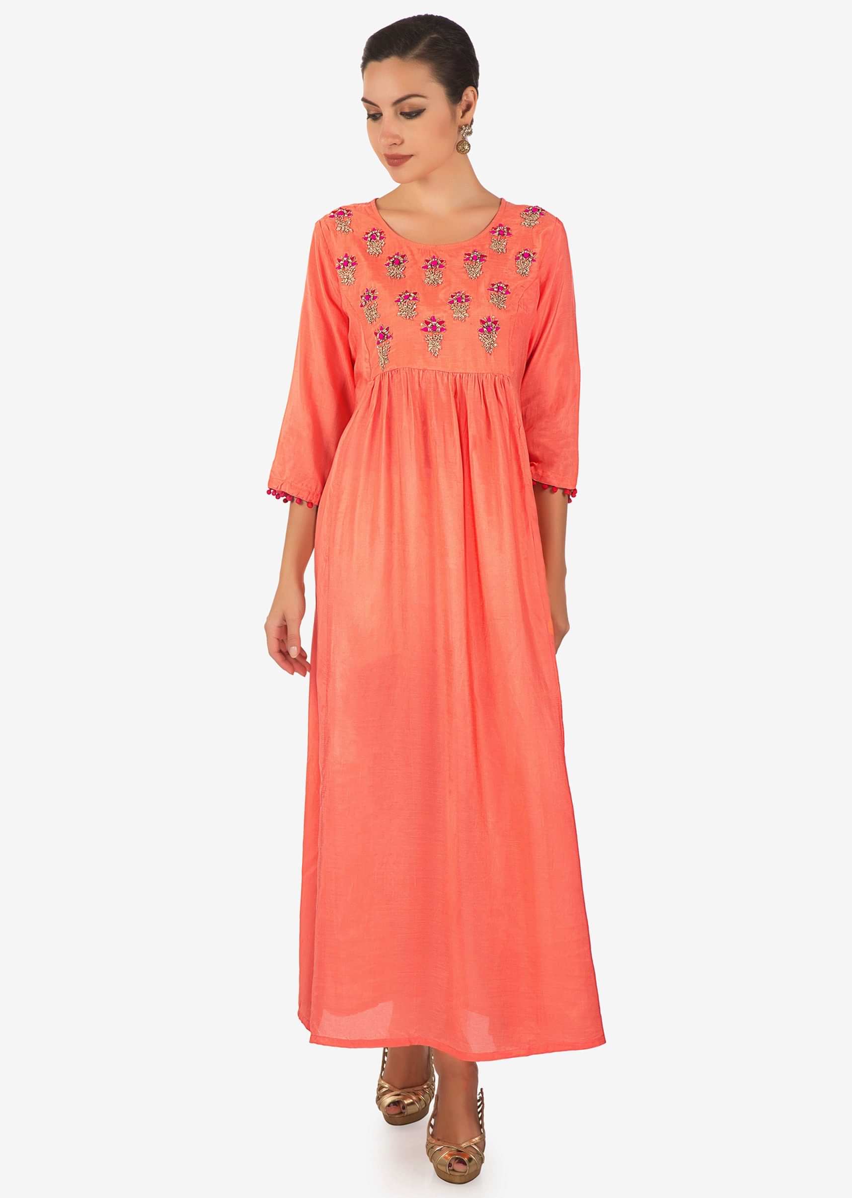 Coral long dress adorn in embroidered butti and gathers only on Kalki
