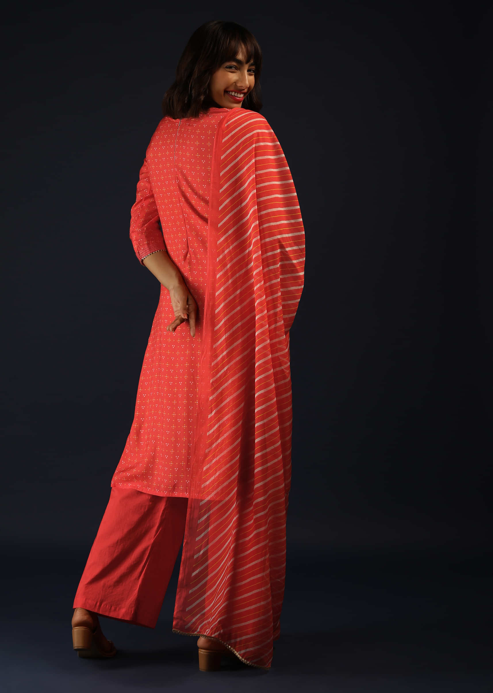 Coral Peach Palazzo Suit In Cotton With Bandhani Print And Lehariya Dupatta  