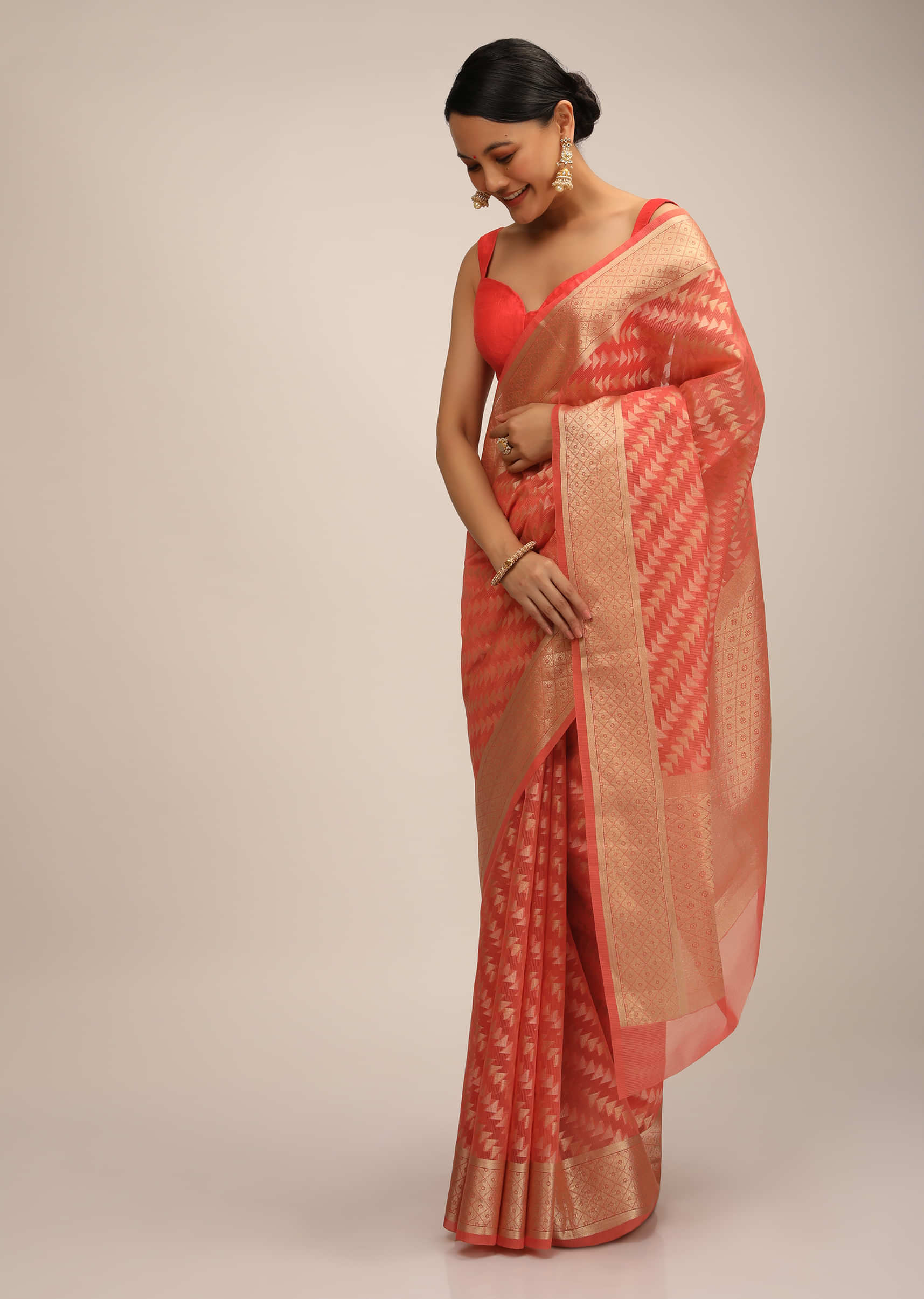 Coral Saree In Jacquard Silk With Two Toned Woven Triangle Motifs In Diagonal Striped Design