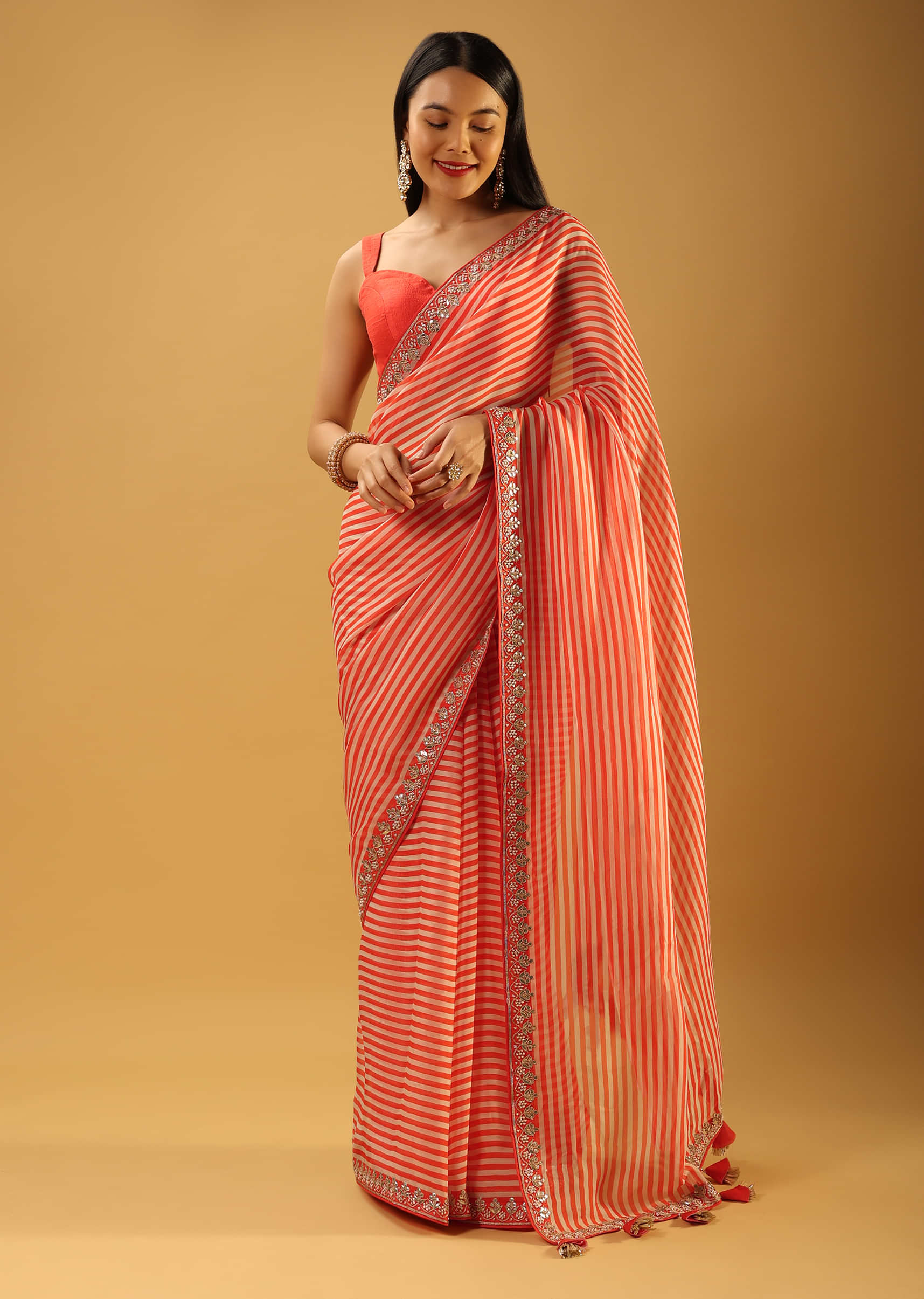 Coral Saree In Organza With Striped Print And Gotta Embroidered Border 