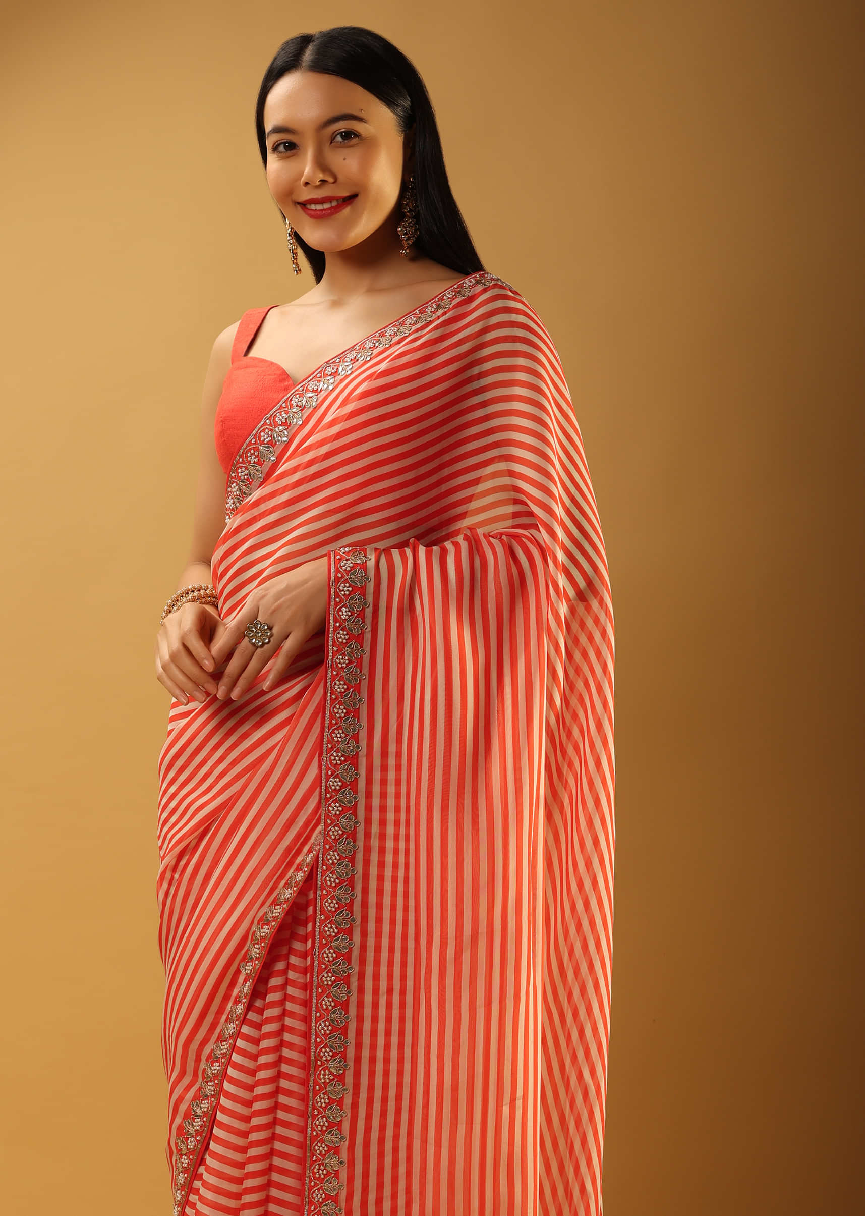 Coral Saree In Organza With Striped Print And Gotta Embroidered Border 