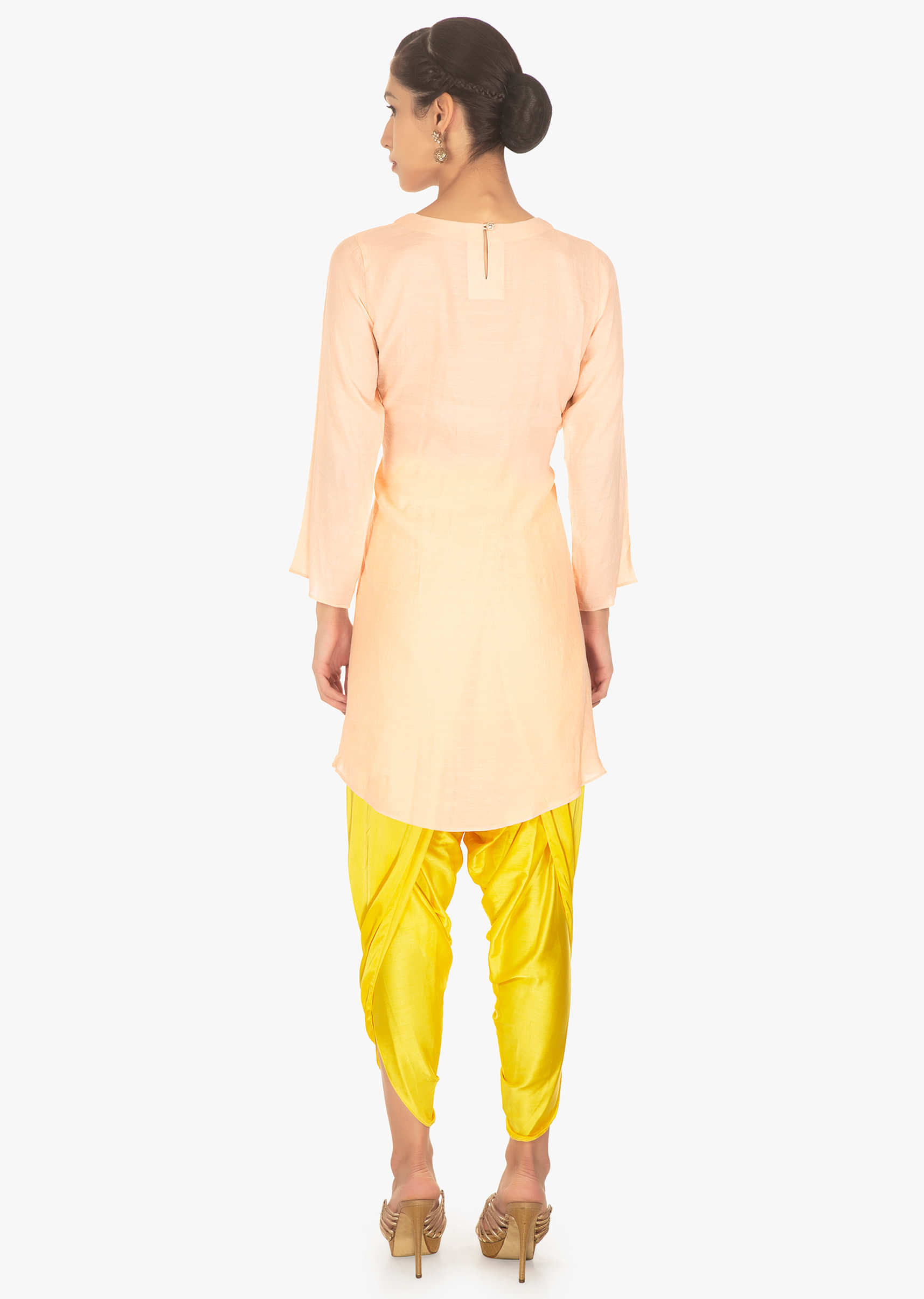 Cotton peach top paired with yellow satin Dhoti 