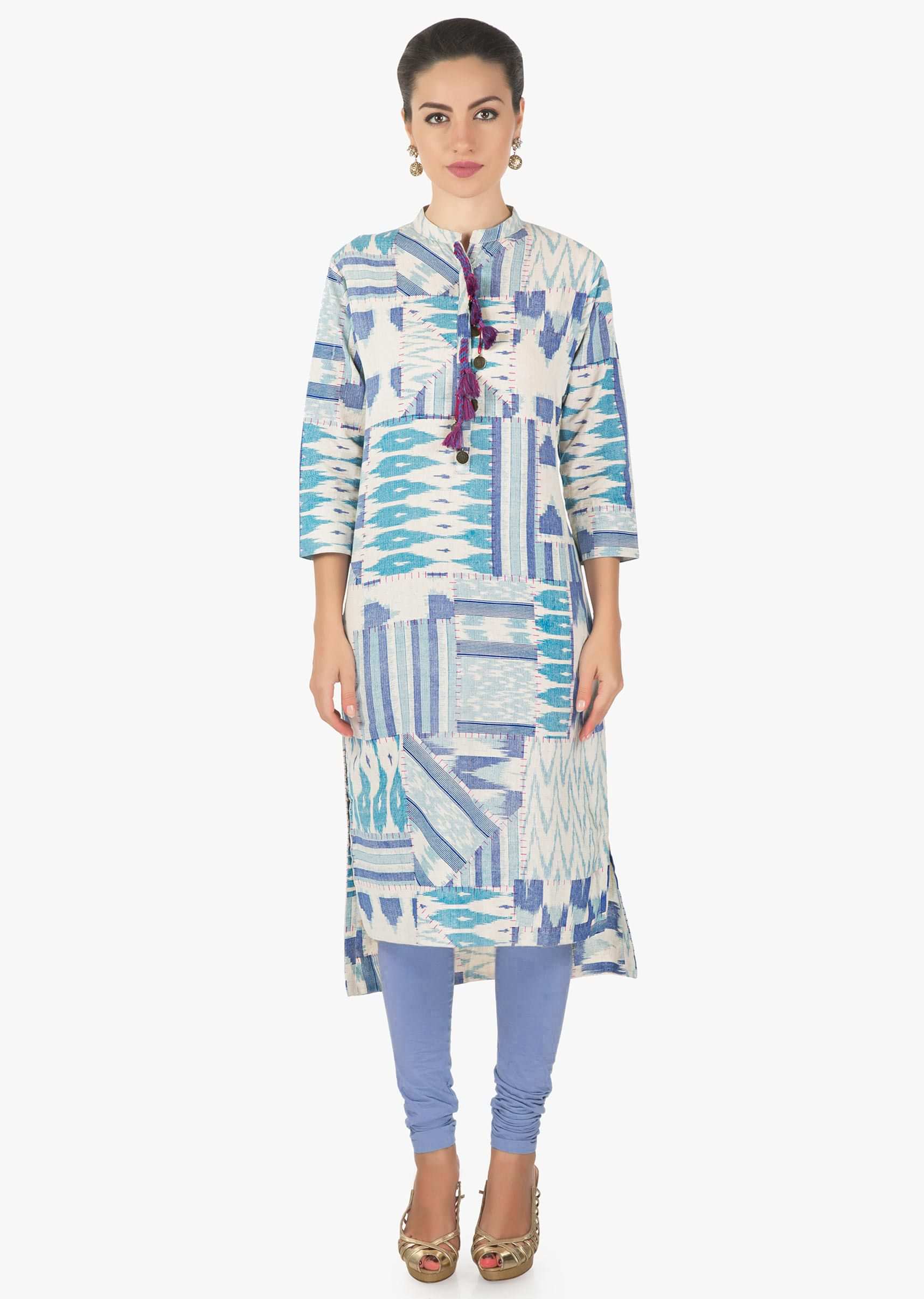 Cream and blue kurti featuring with fancy tassel on placket only on Kalki