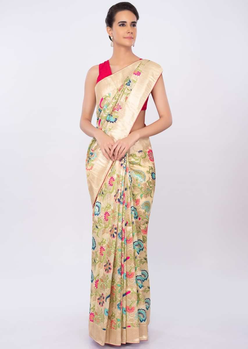 Cream beige brocade saree in multi color floral embroidery only on kalki