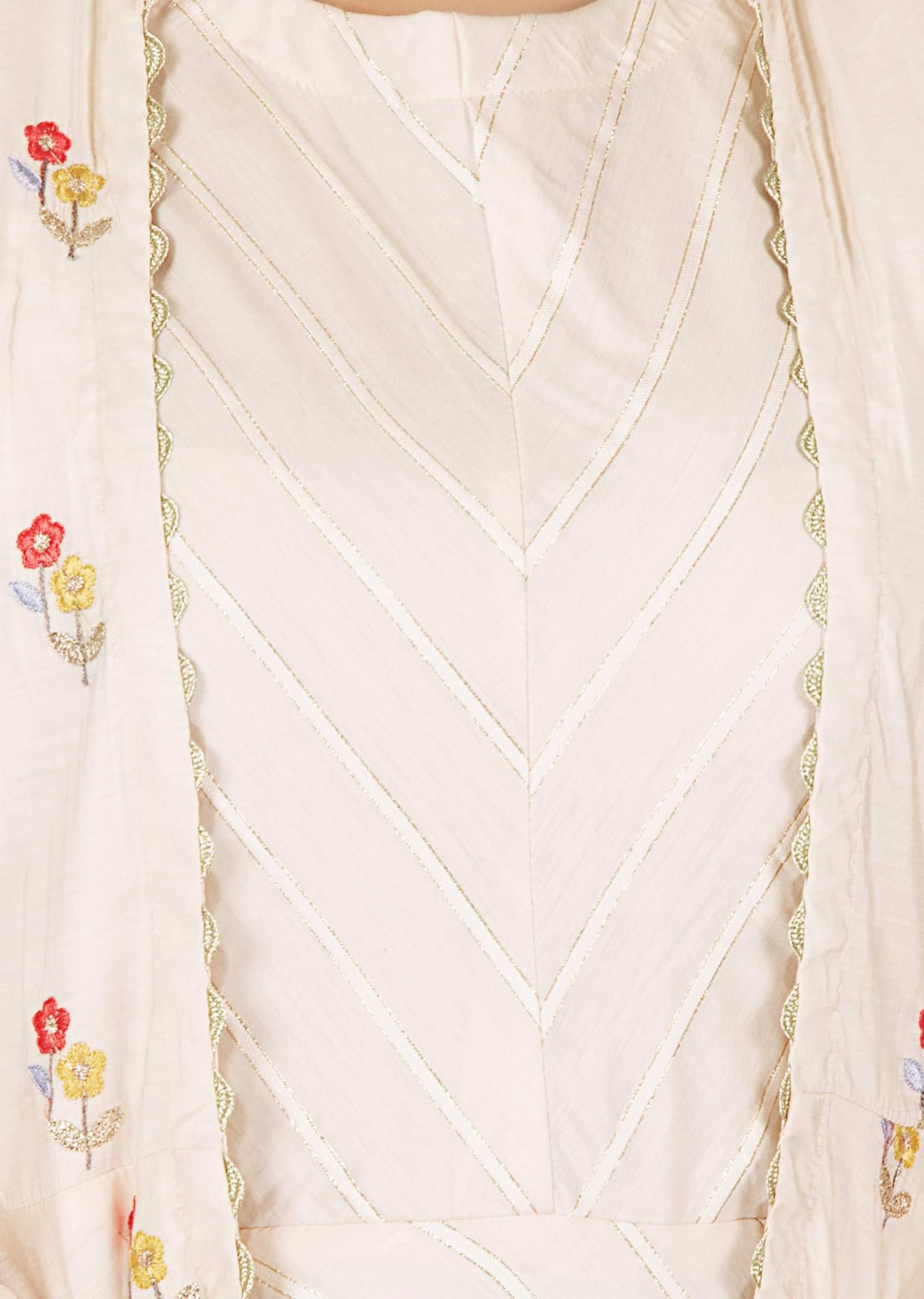 Cream cotton dress matched with a resham embroidery floral motifs jacket only on kalki