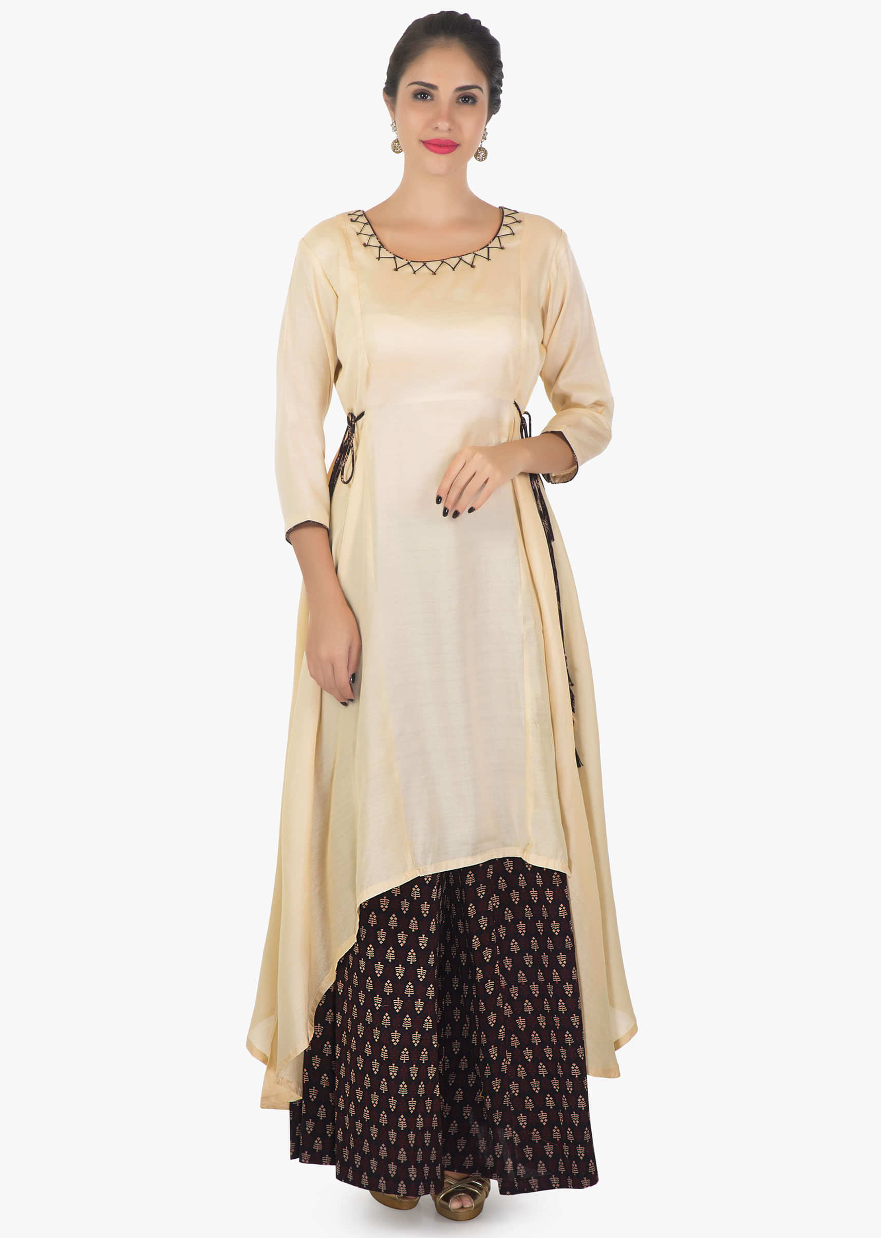 Cream cotton kurti matched with printed palazzo with tie ups thread work only on kalki