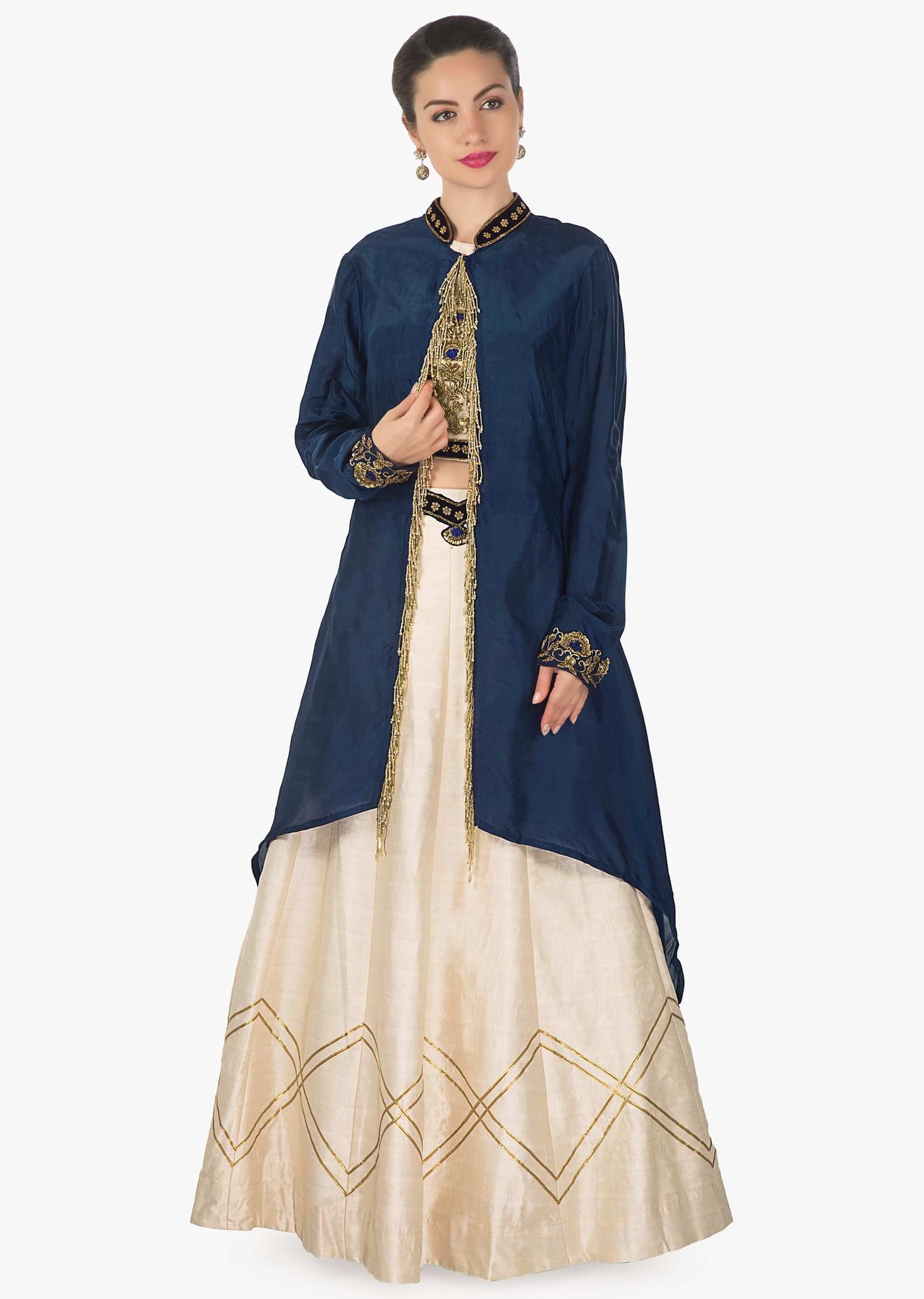 Cream lehenga and blouse in raw silk with navy blue jacket adorn in tassel only on Kalki