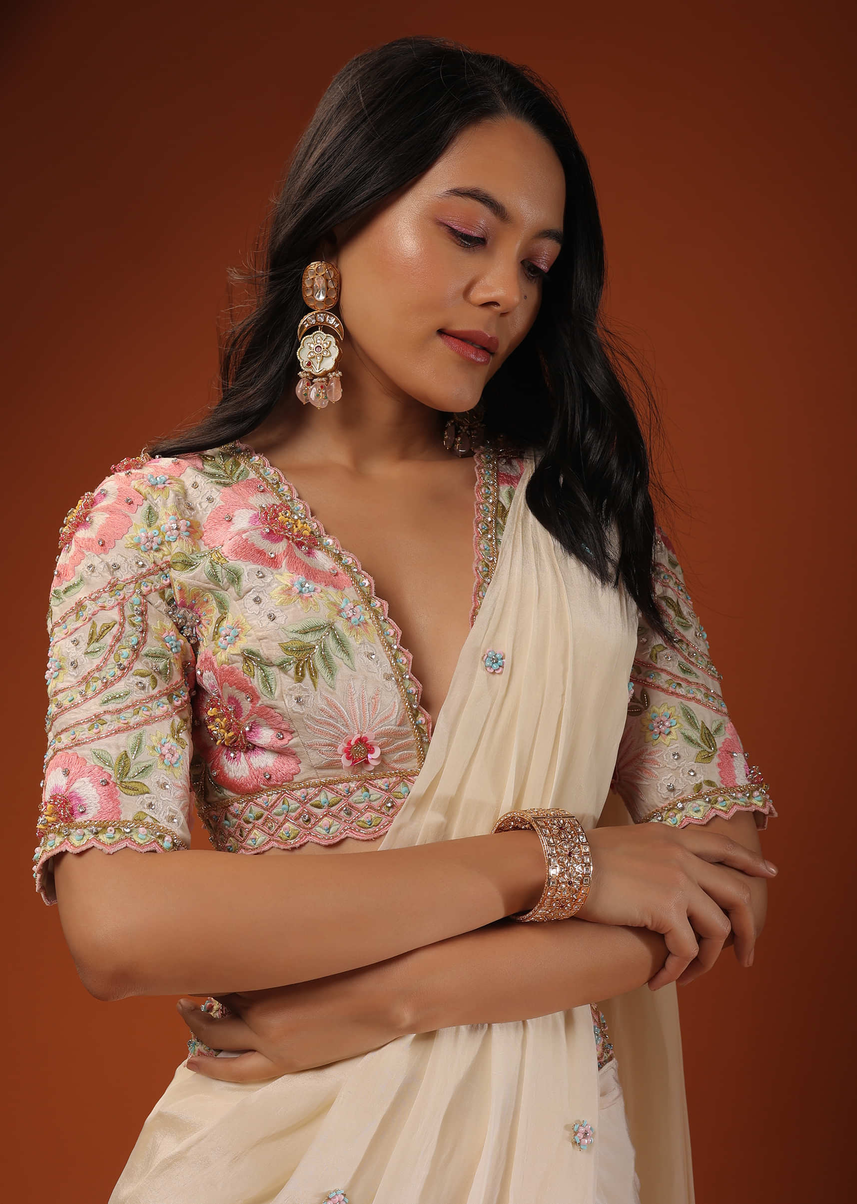 Cream Ready Pleated Saree With Multi Colored Floral Hand Work On The Blouse