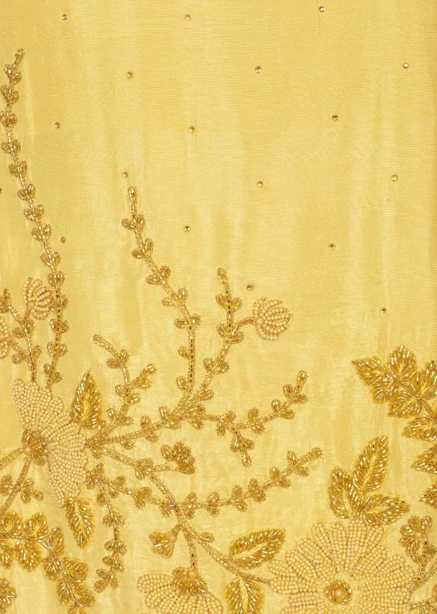 Cream yellow santoon unstitchedsuit with kundan butti