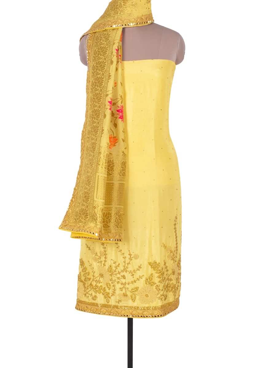 Cream yellow santoon unstitchedsuit with kundan butti