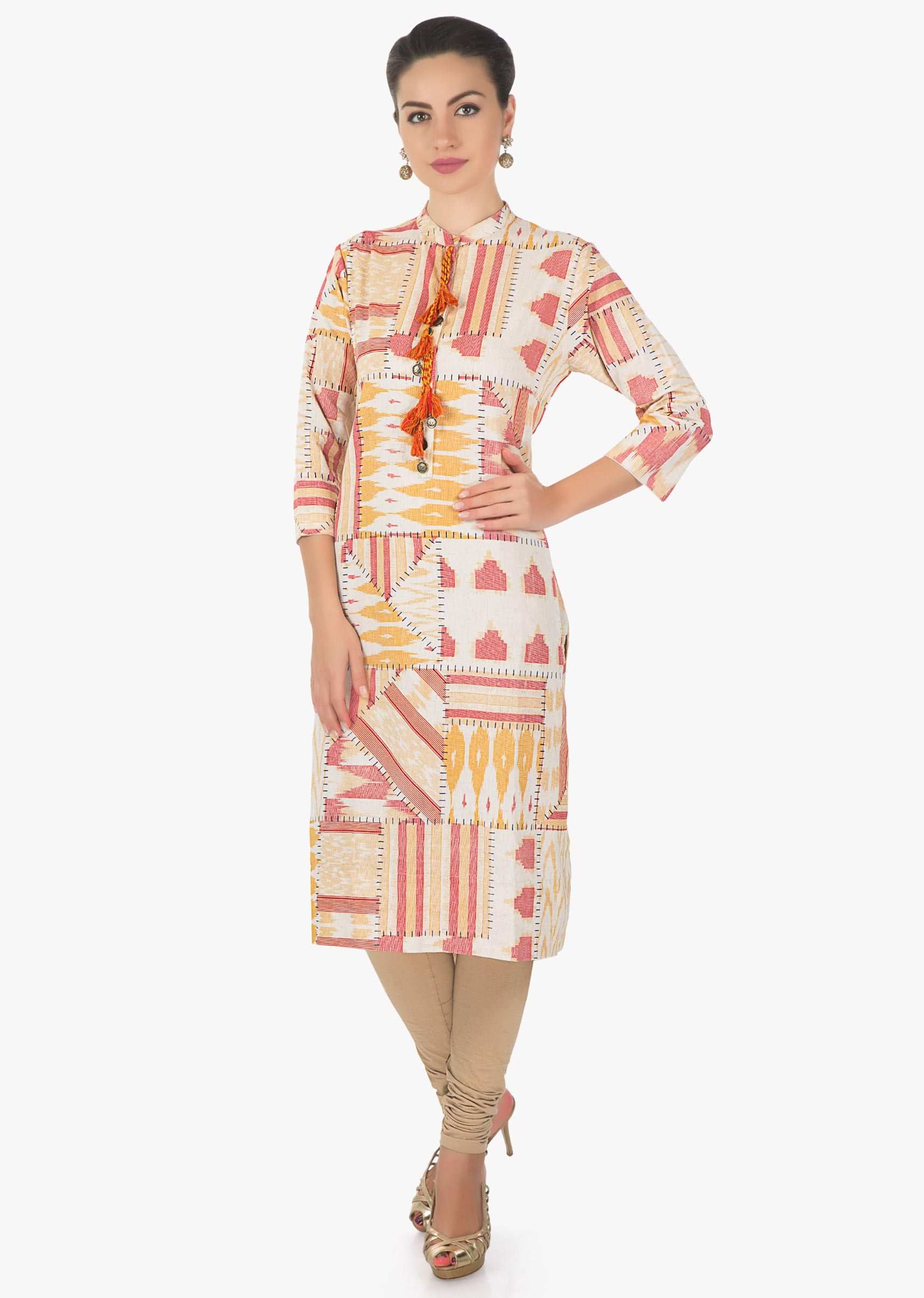 Cream, rust and orange blue kurti featuring with fancy tassel on placket only on Kalki
