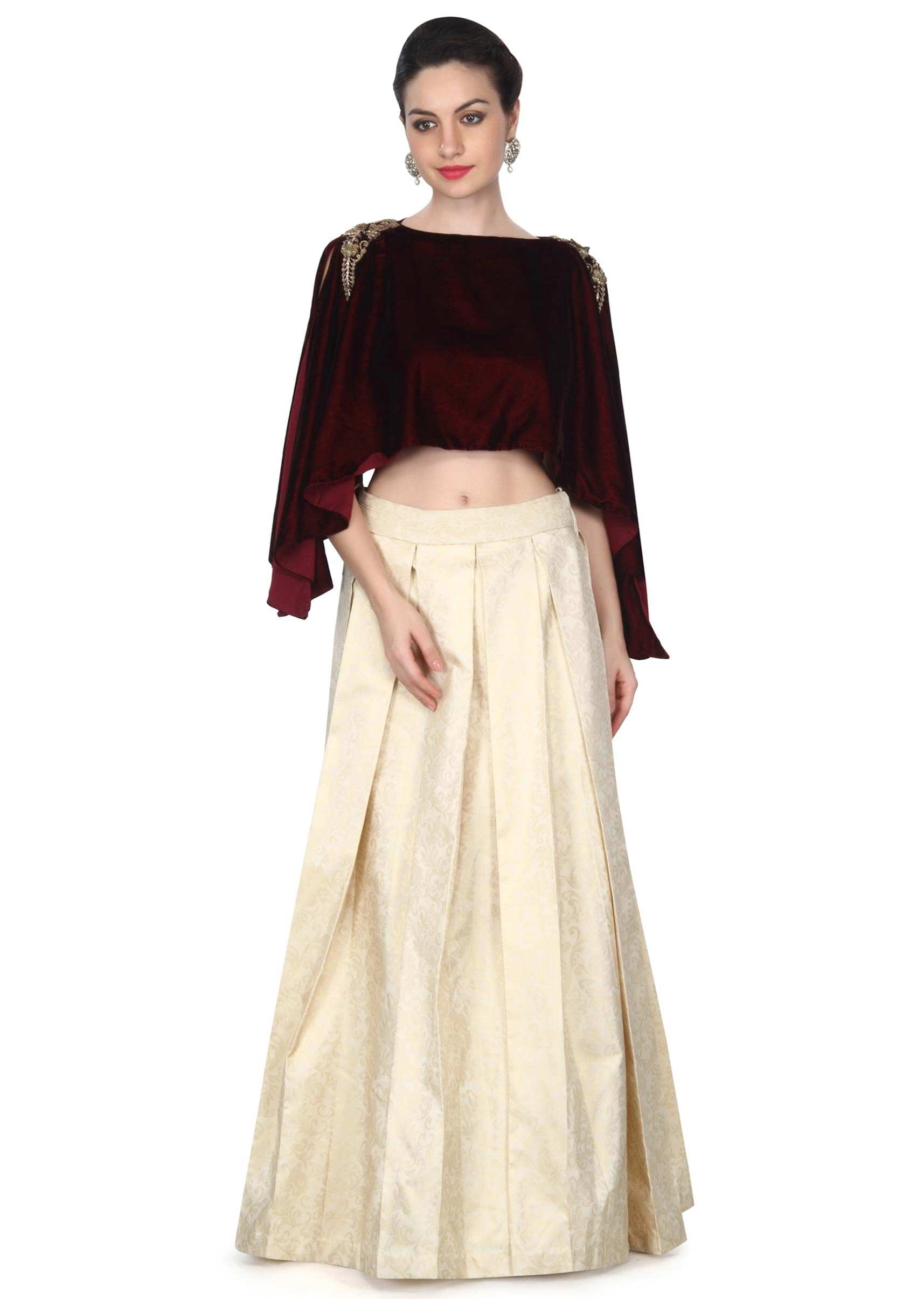 Cream lehenga matched with maroon cape only on Kalki