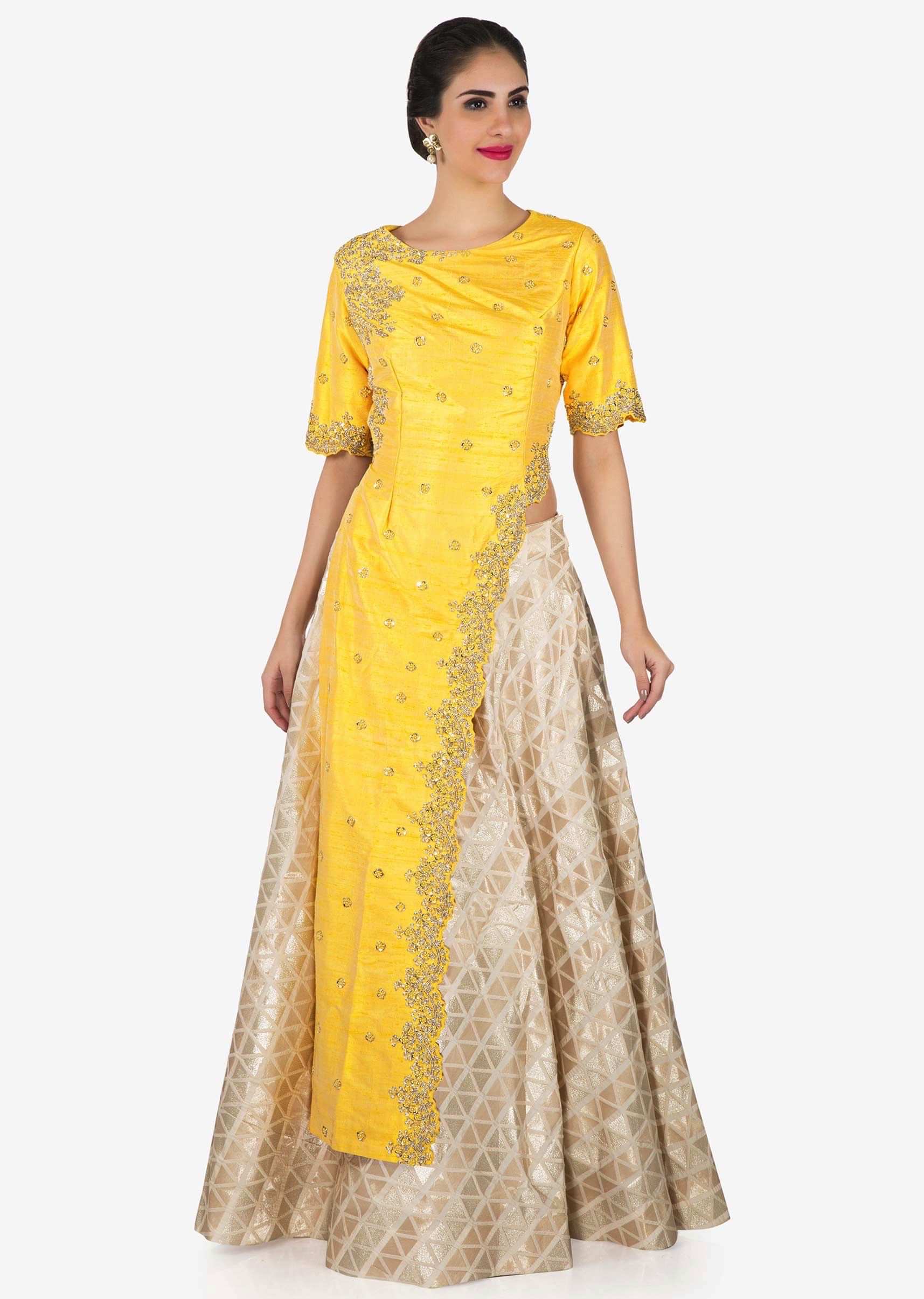 Cream lehenga with long yellow embroidered top only on Kalki
