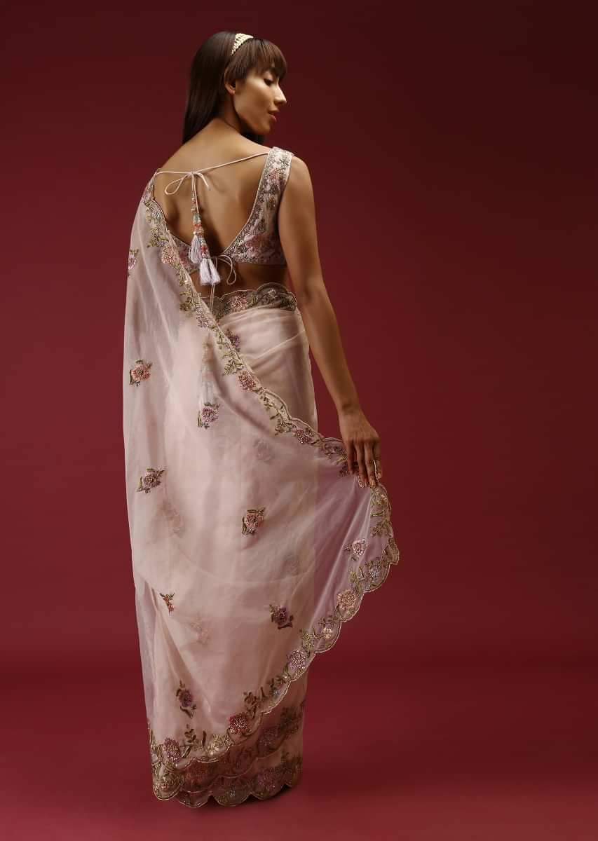 Cream Saree In Organza With Multi Colored Hand Embroidered Buttis And A Blouse With Front Cut Out  