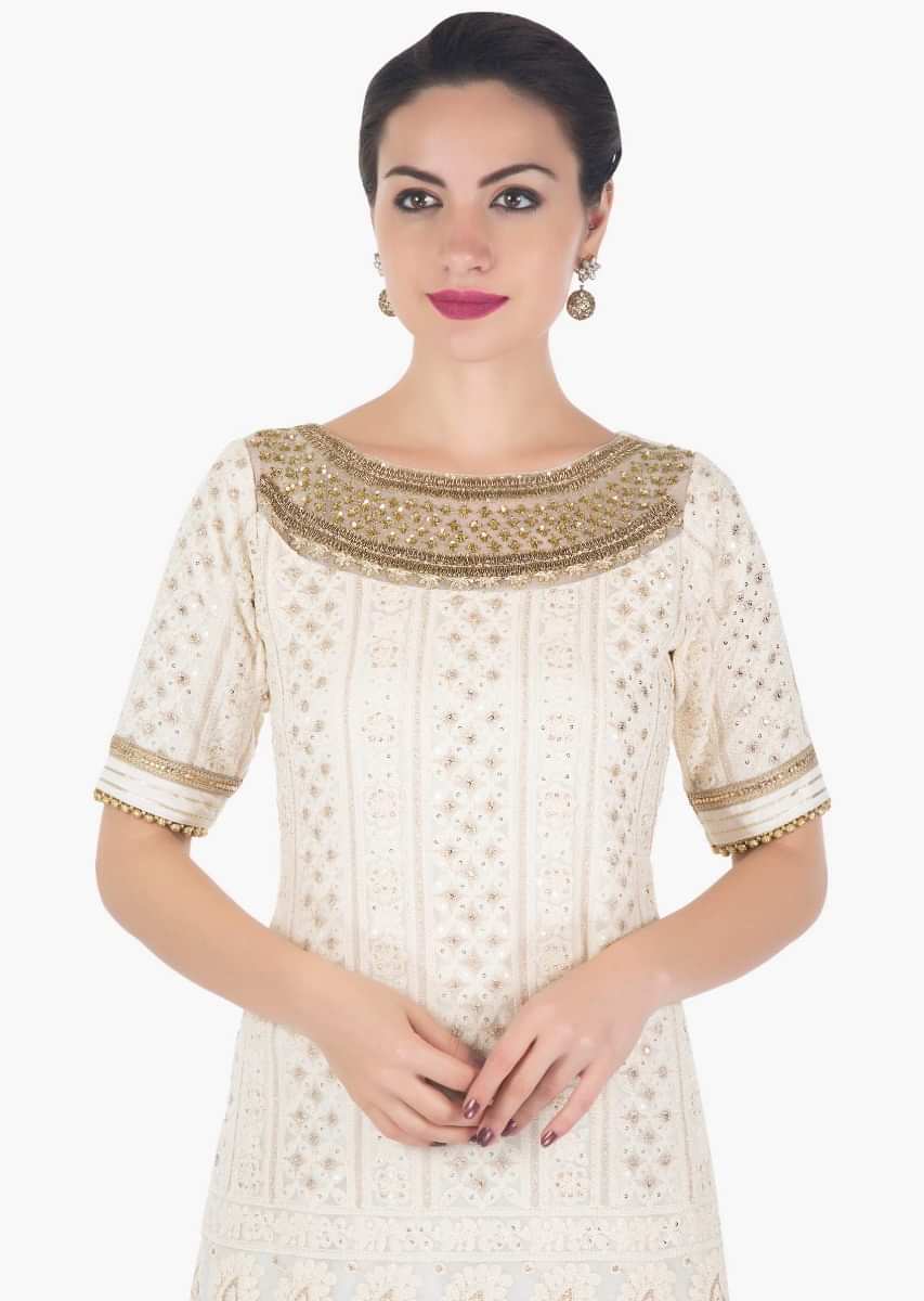 Cream straight suit in thread and sequin work with yellow salwar and net dupatta only on Kalki